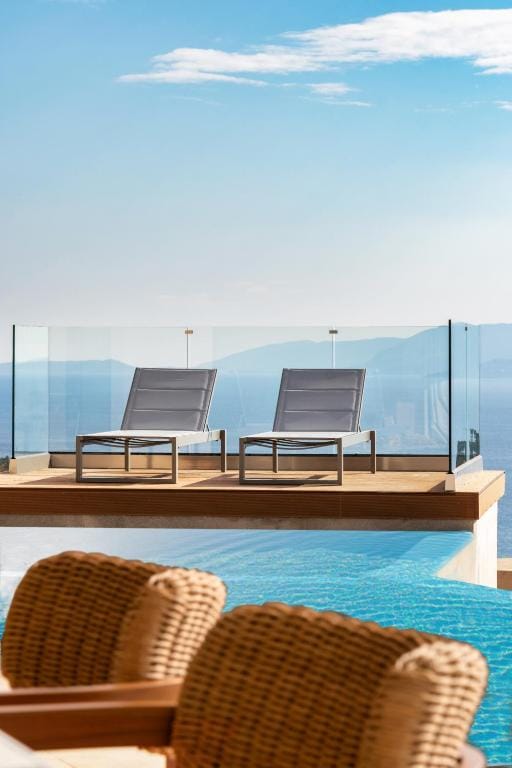 a pool with chairs and a table