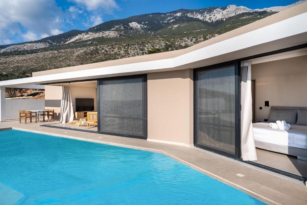 a swimming pool with a mountain in the background