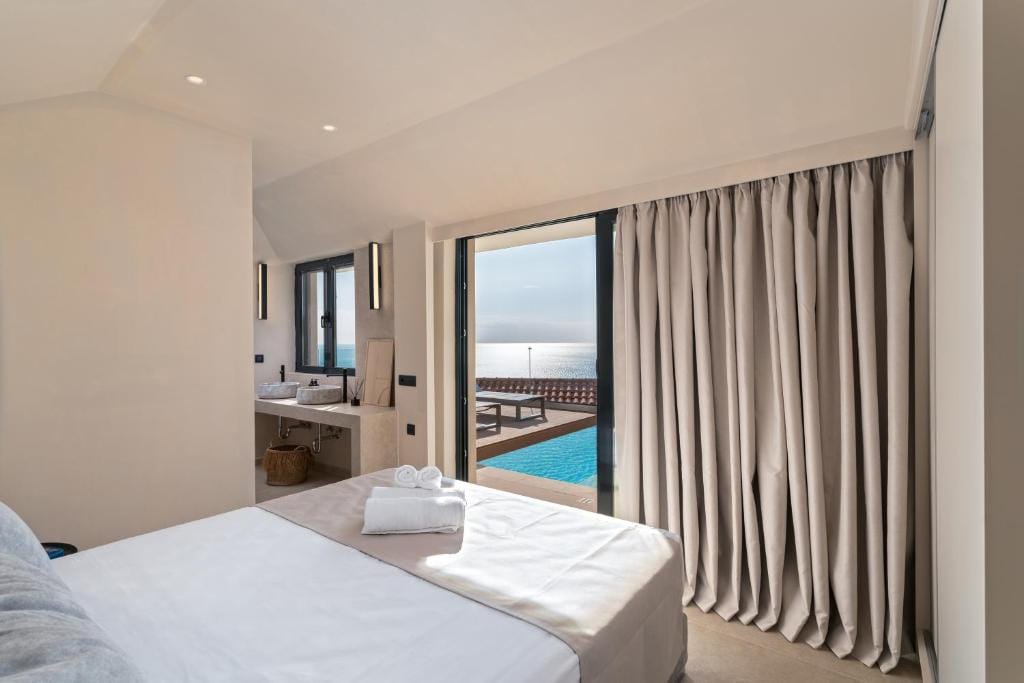 a bedroom with a large glass door