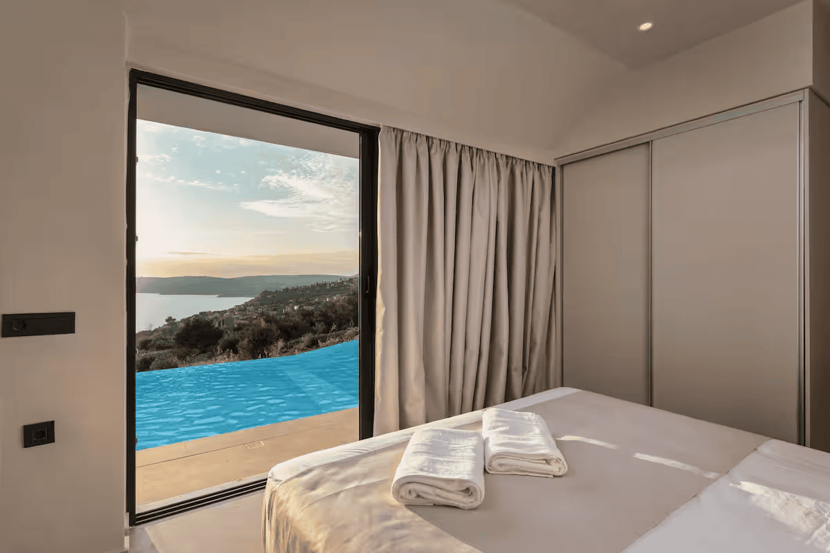 a bedroom with a large window