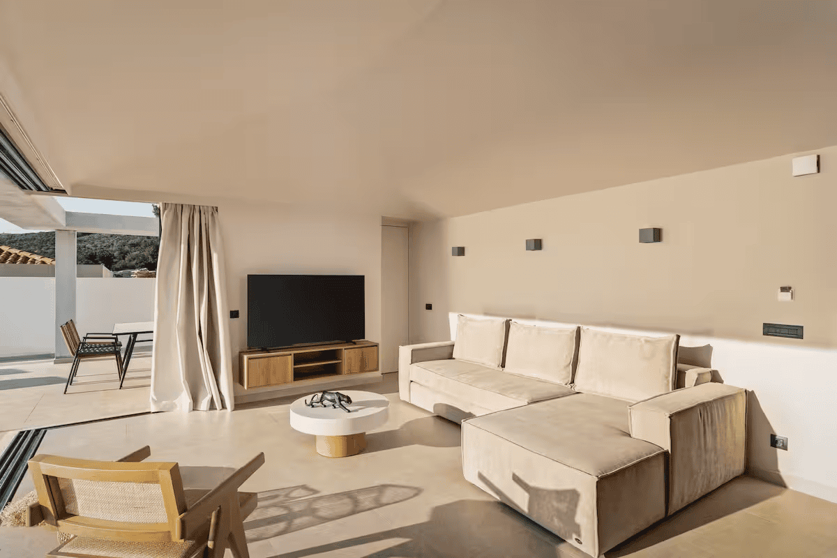 a living room with a tv and couches