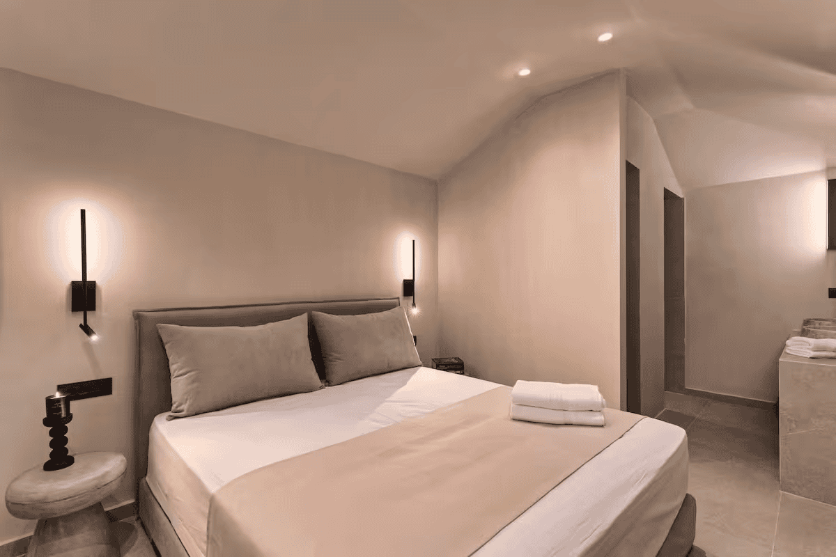 a hotel room with a bed and a toilet
