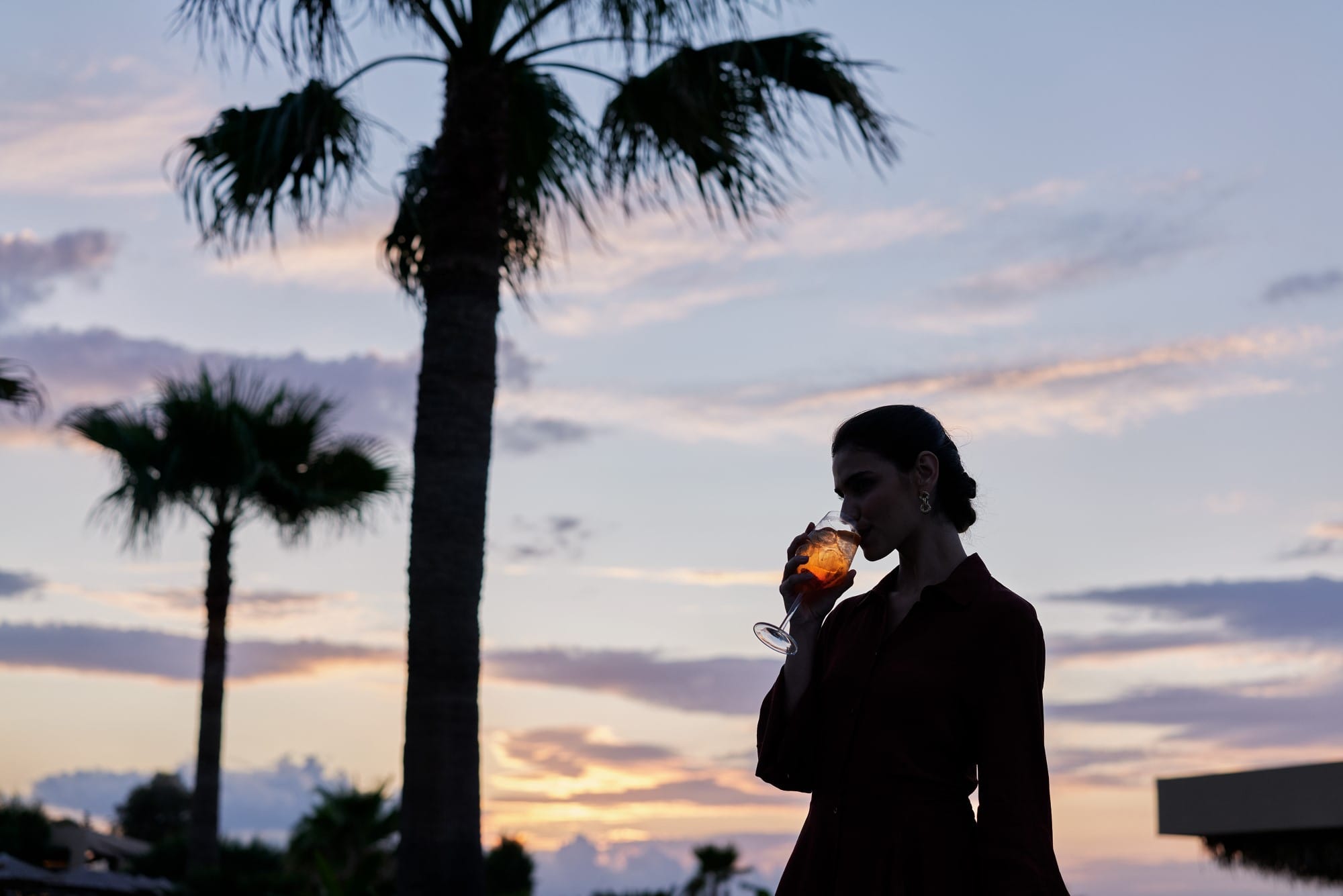 a person drinking from a glass