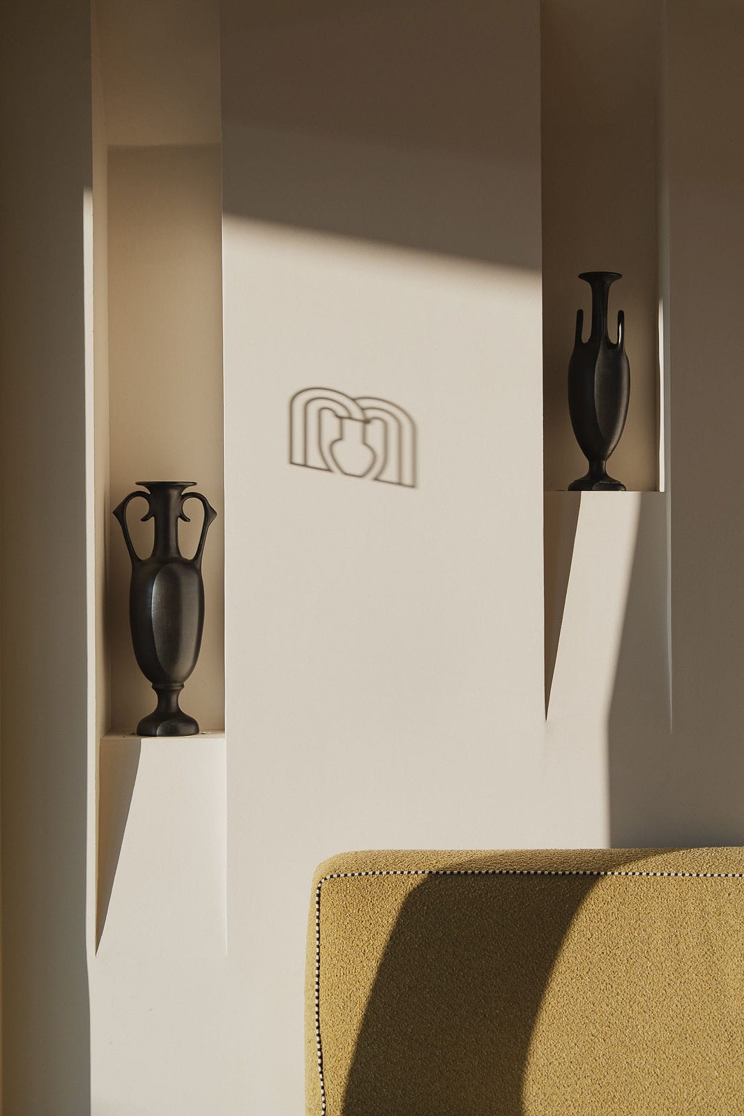 a couple of vases on a shelf