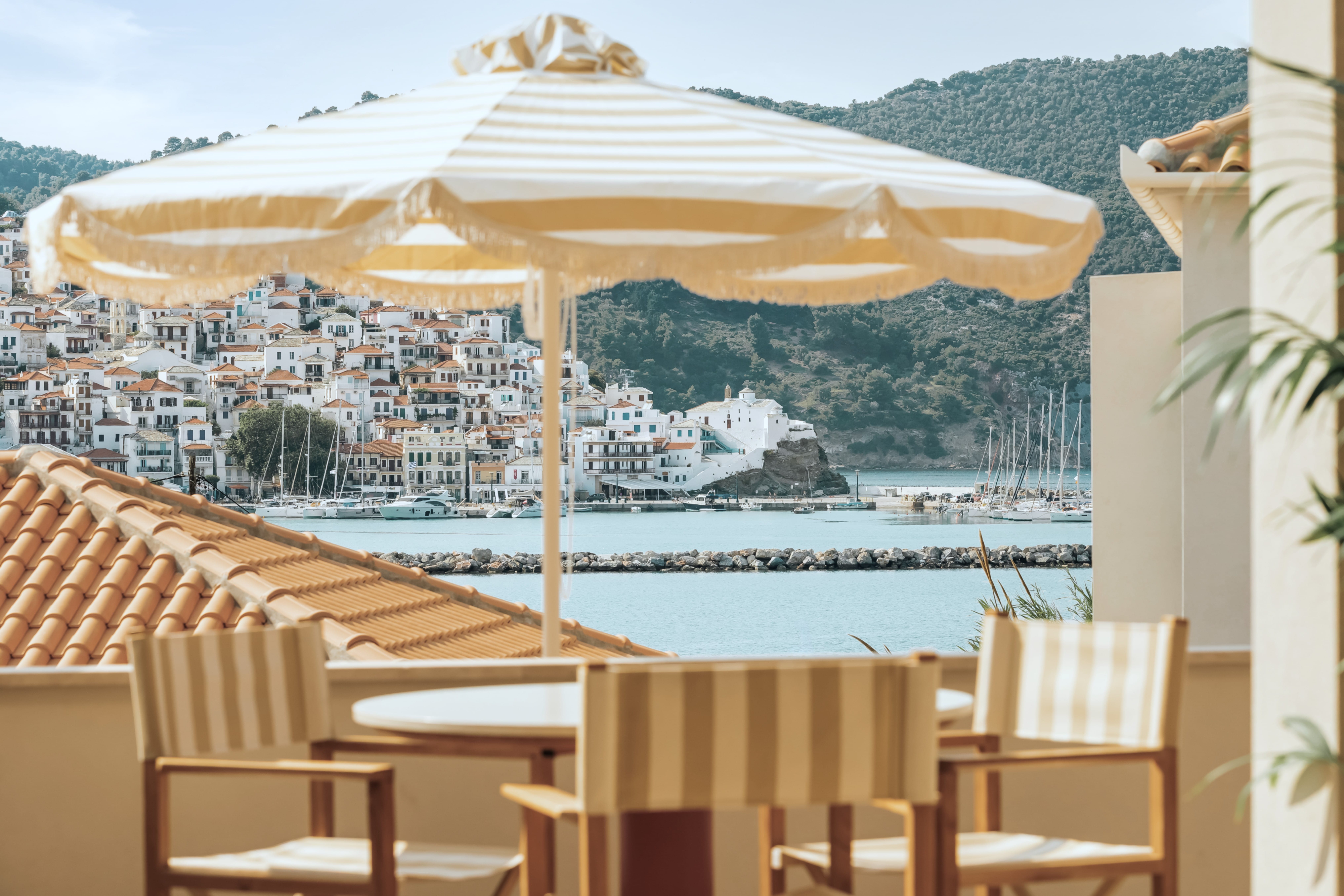 a deck with chairs and a table