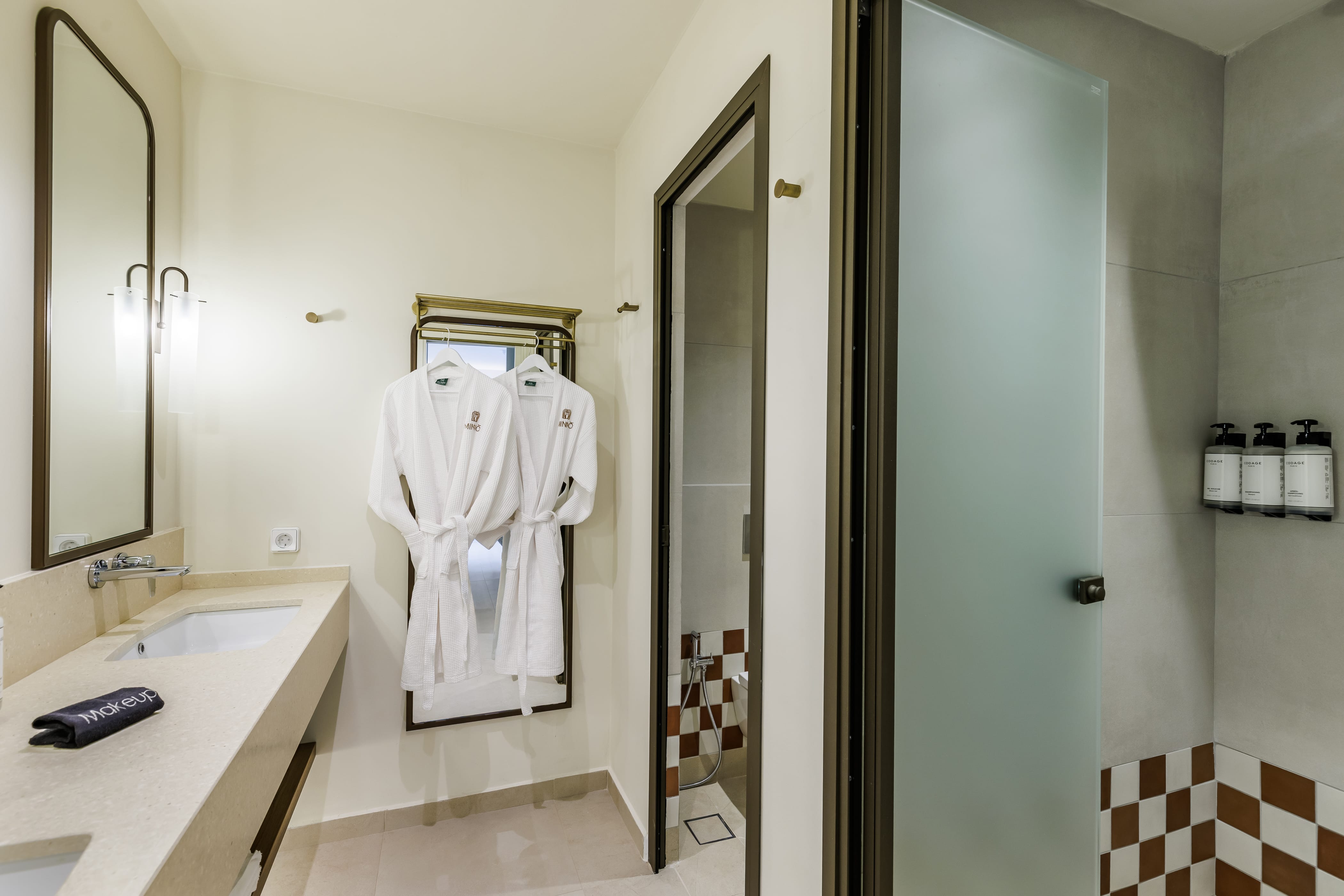 a bathroom with a shower and a sink