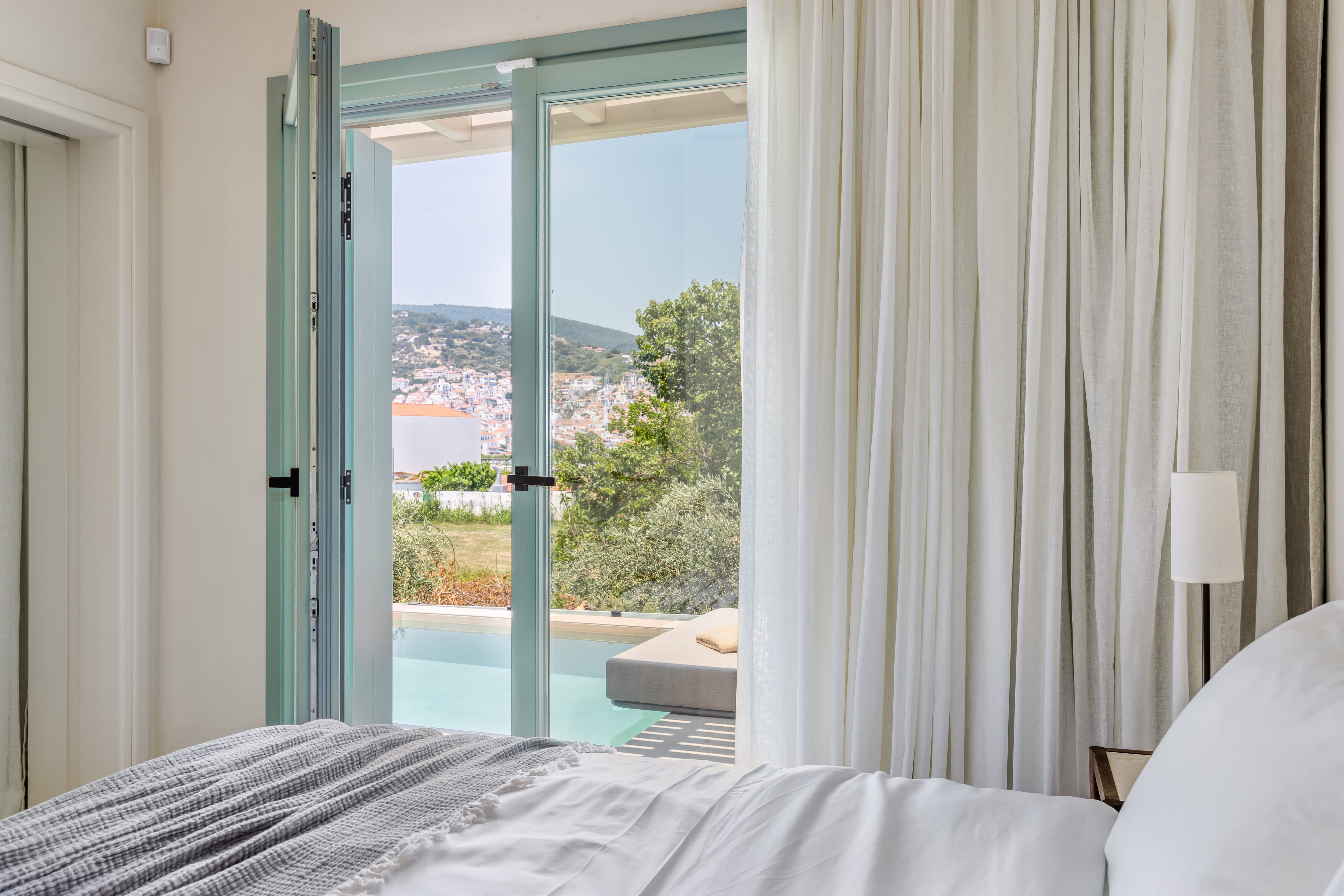 a bedroom with a large window