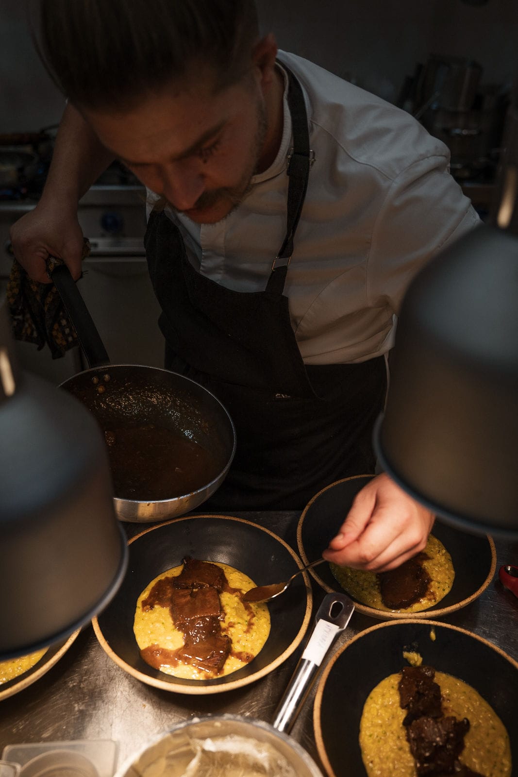 a person cooking food on a stove