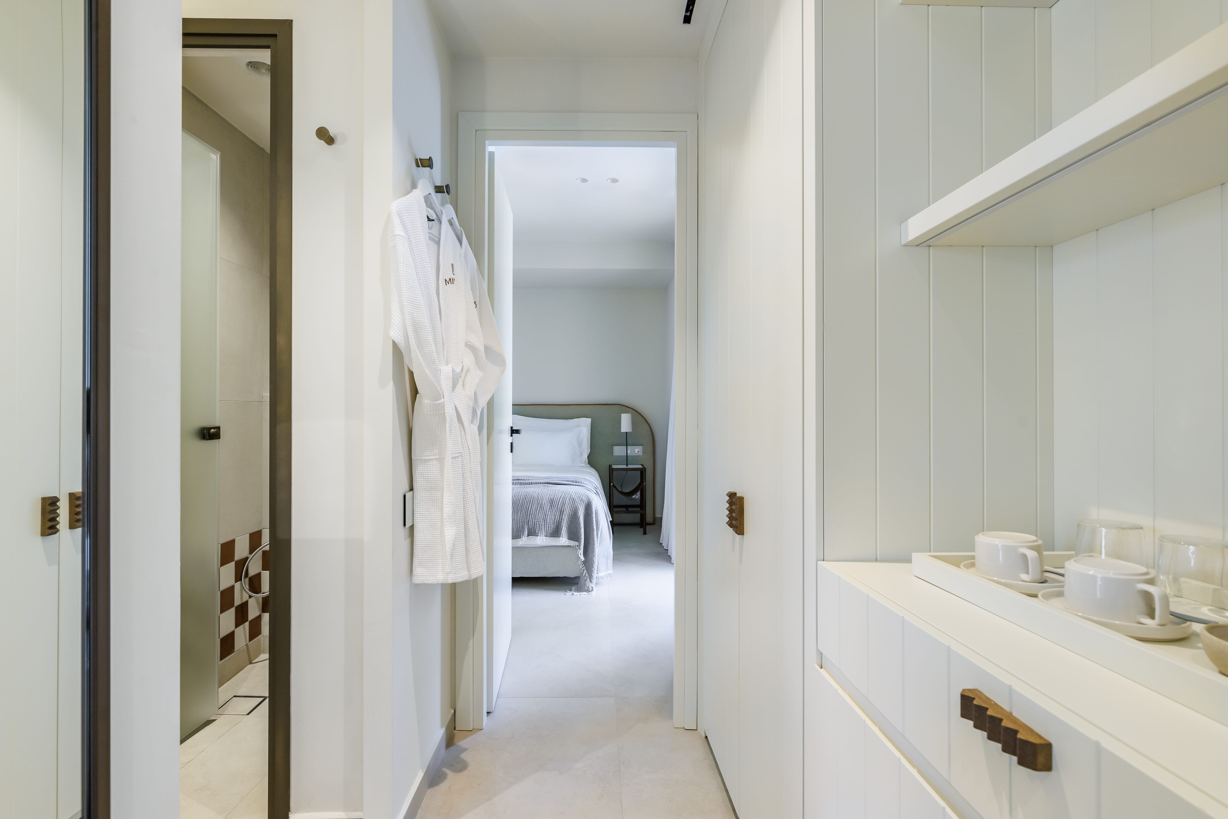 a bathroom with a bed and a sink