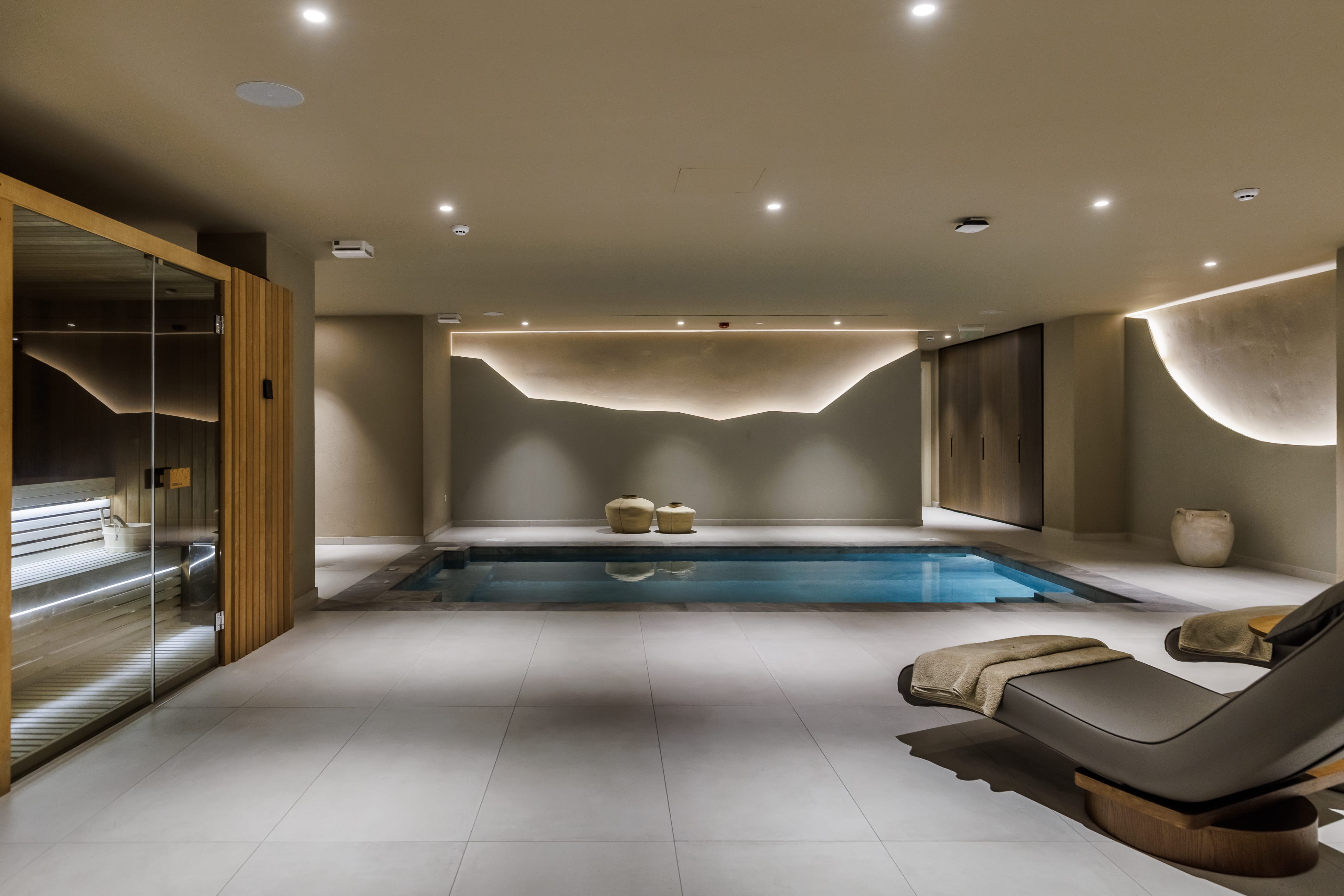 a large room with a pool table and chairs