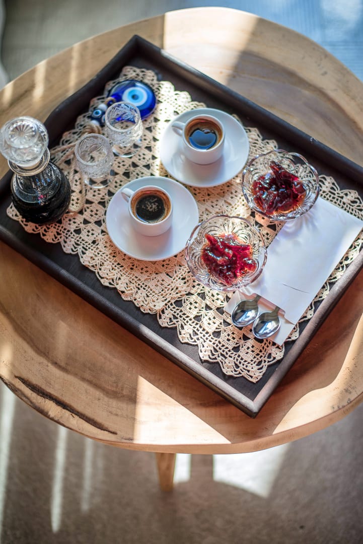 a tray with cups and glasses on it