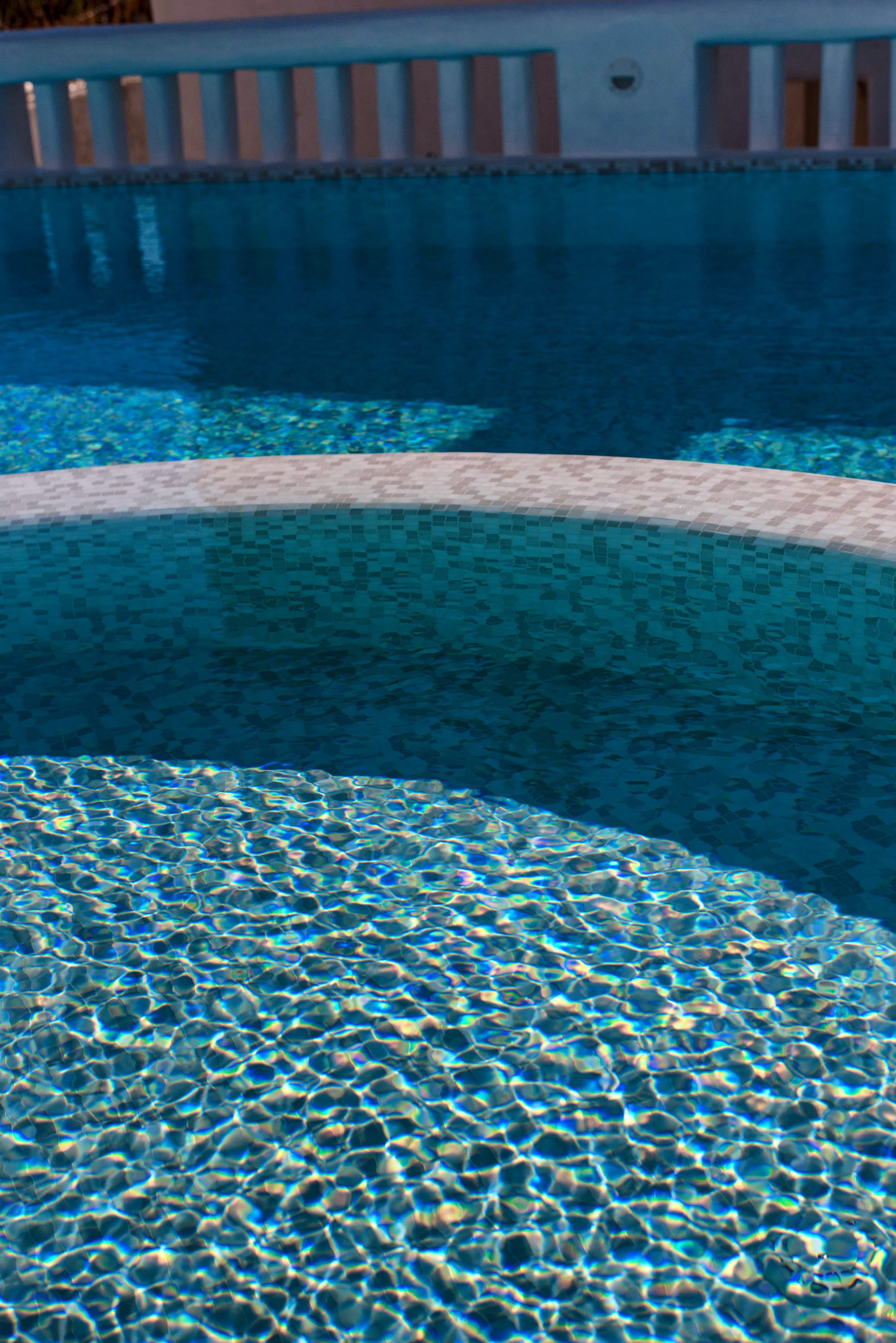 a pool with a building in the background