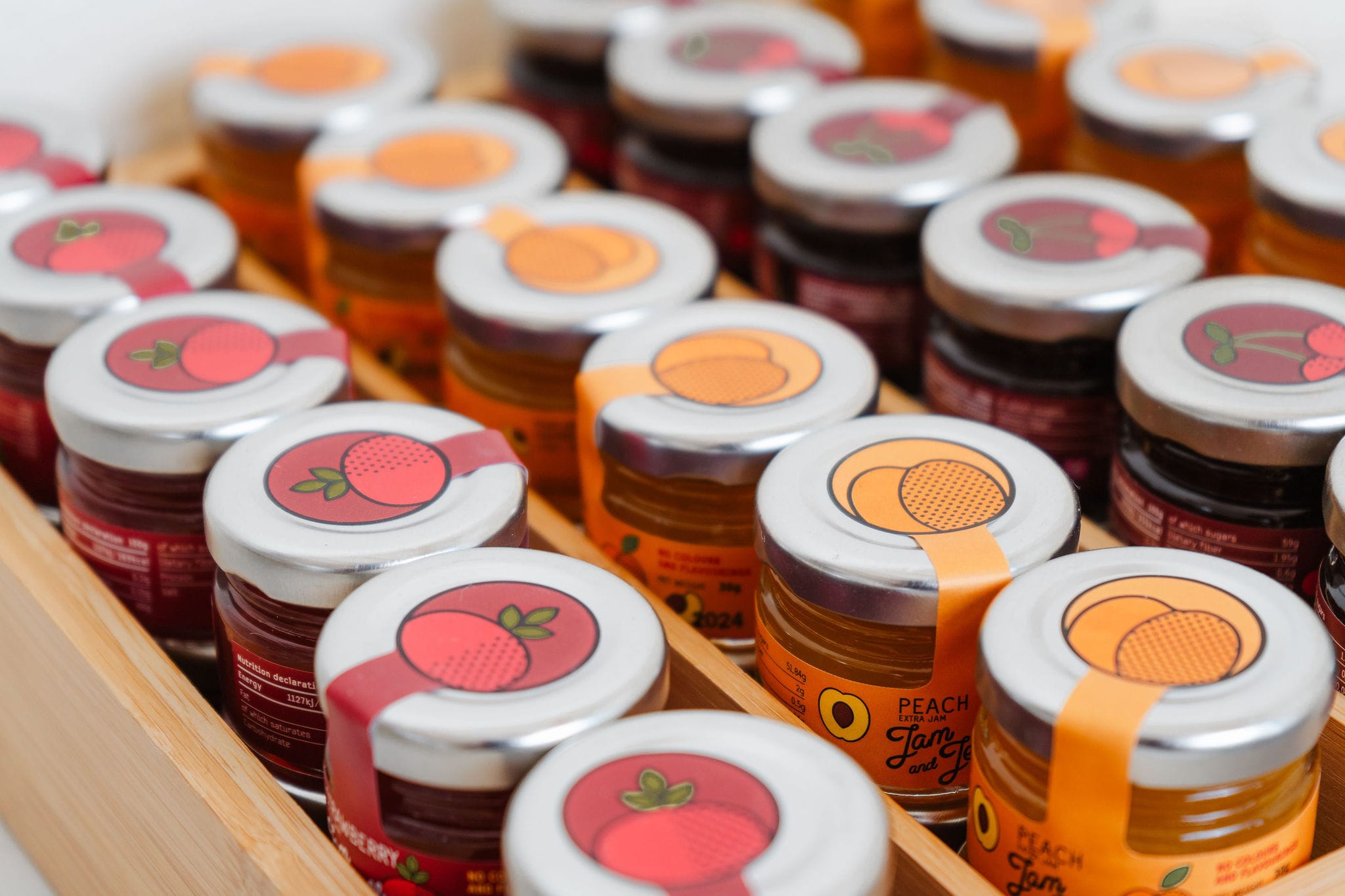 a group of plastic containers with red and white liquid in them
