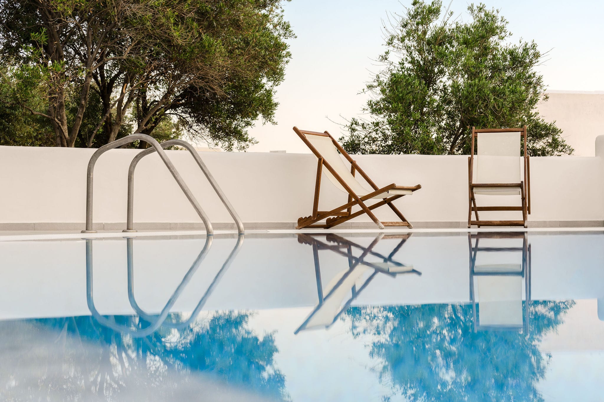 a table and chairs in a pool