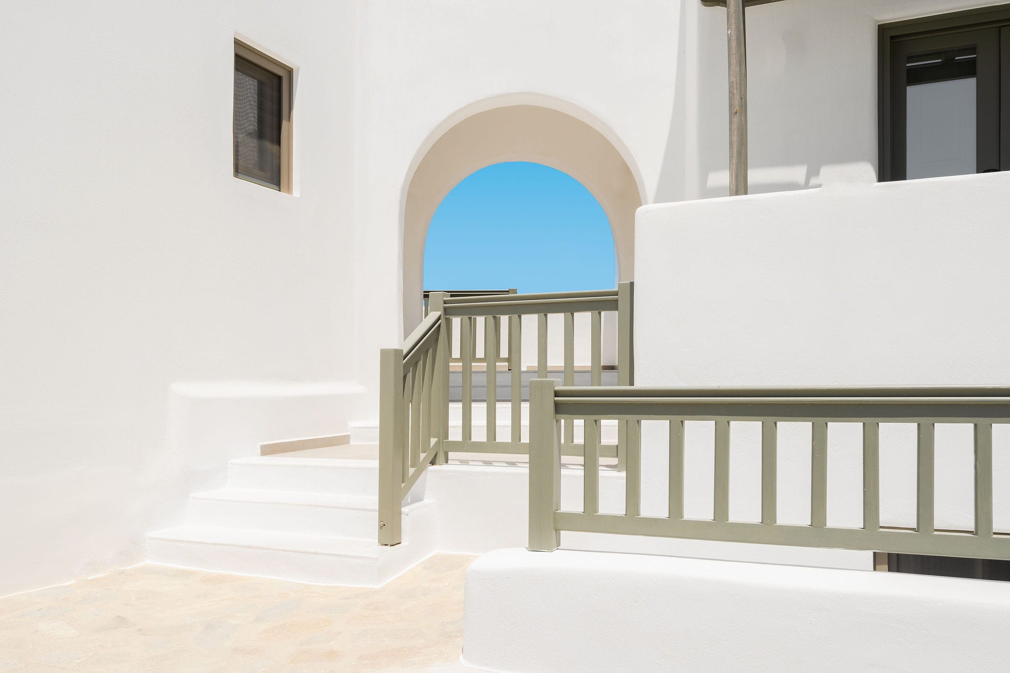 a white building with a fence