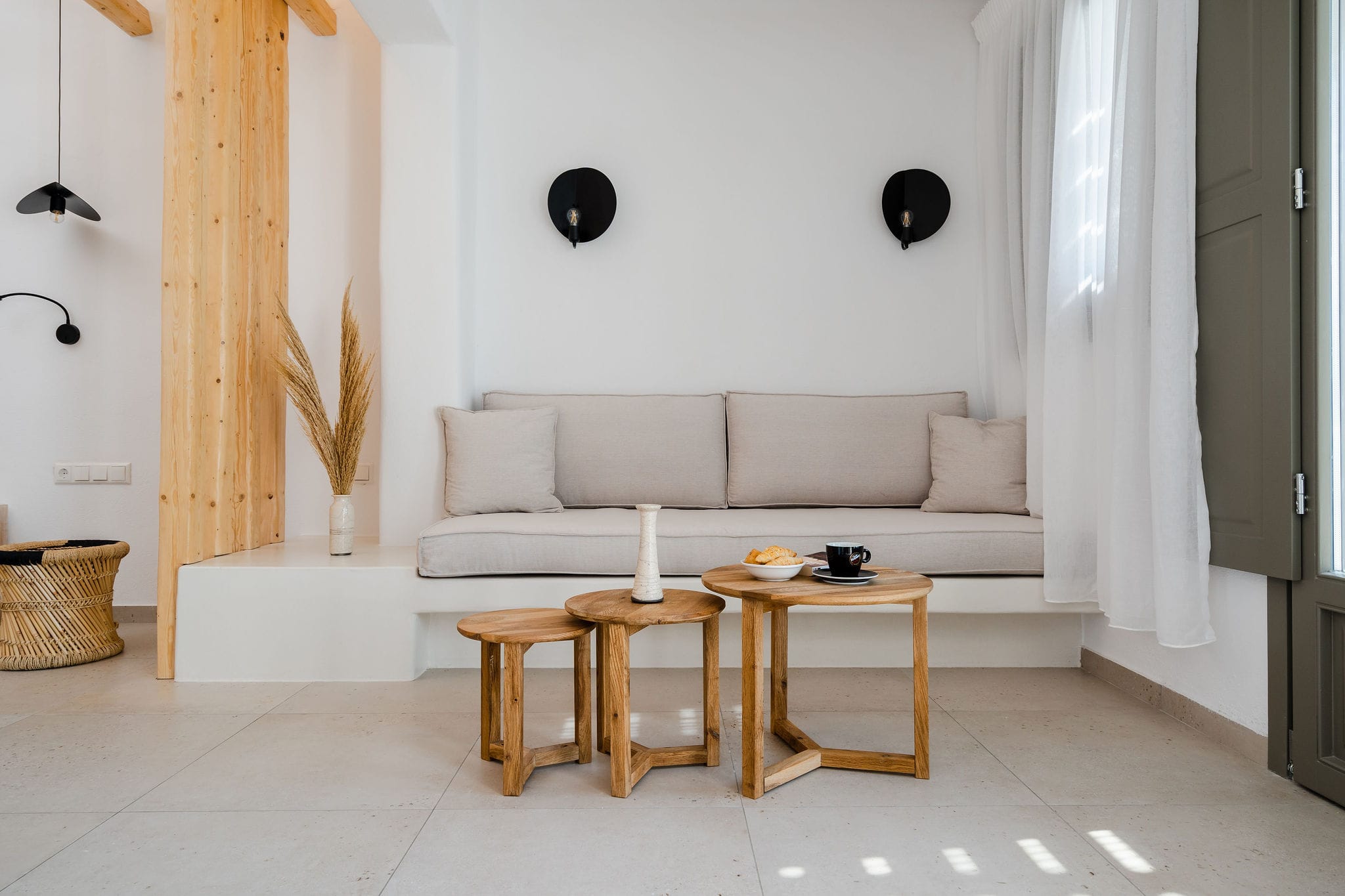a living room with a white couch and coffee table