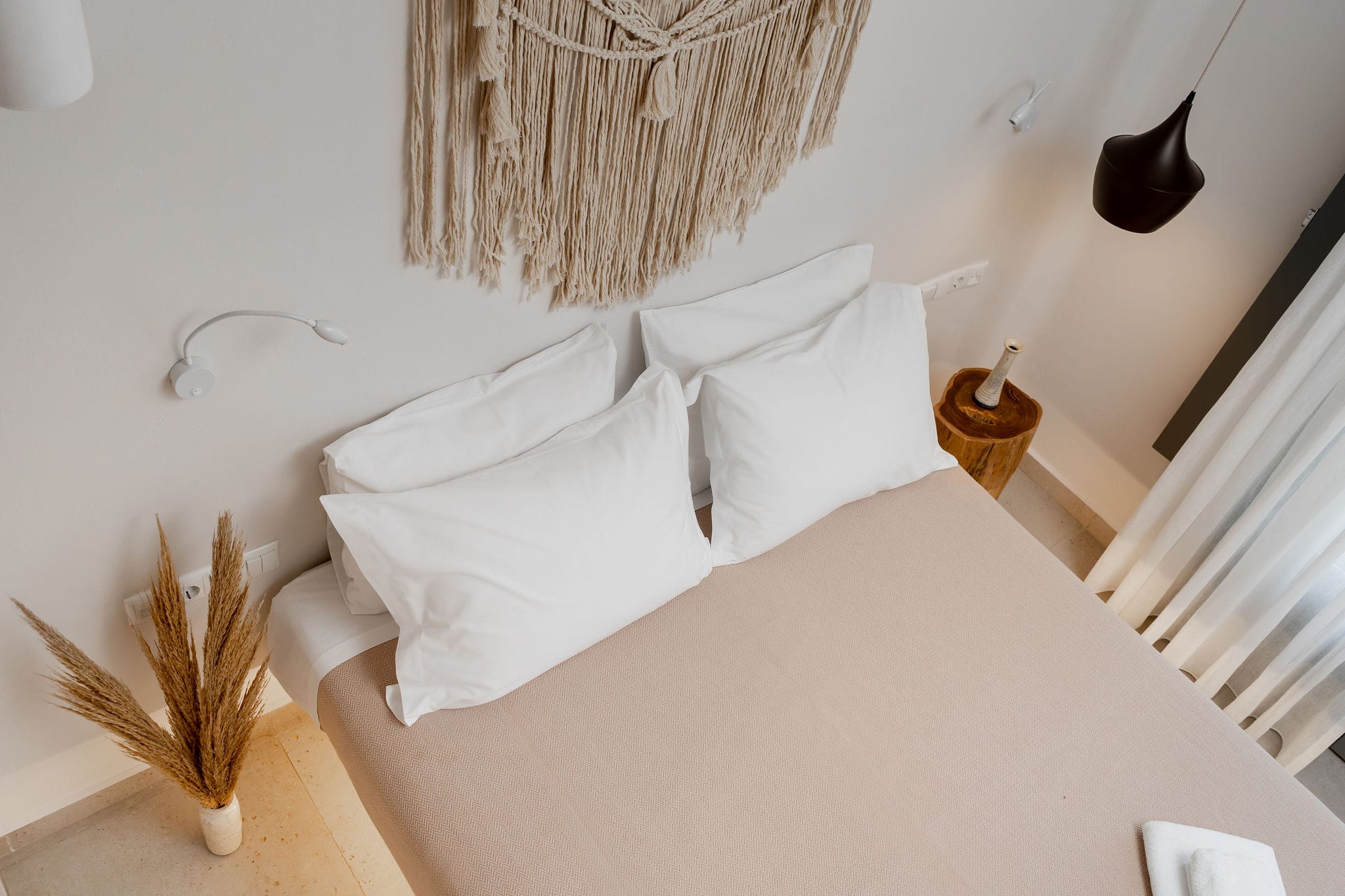 a bed with white sheets