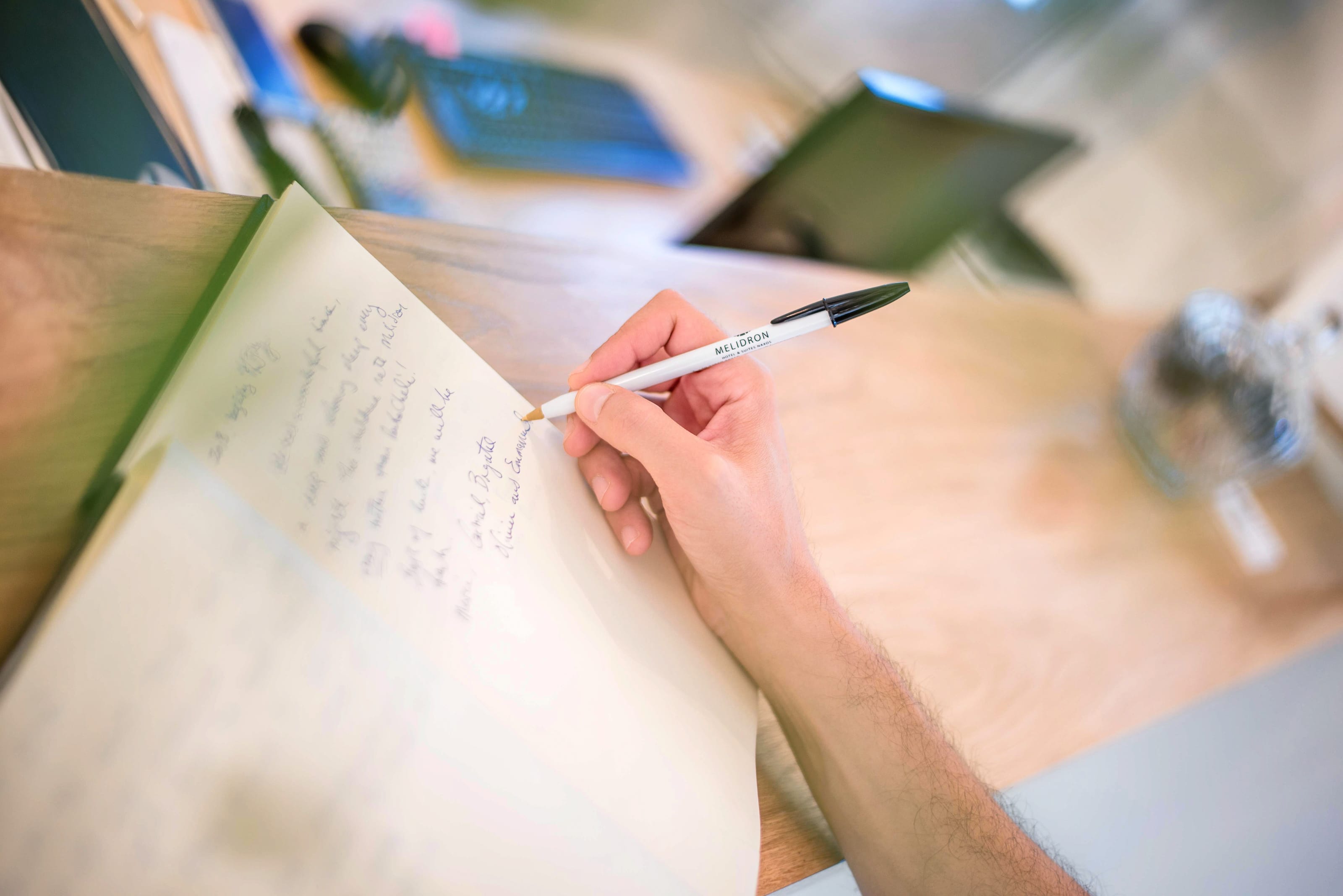 a hand holding a pen
