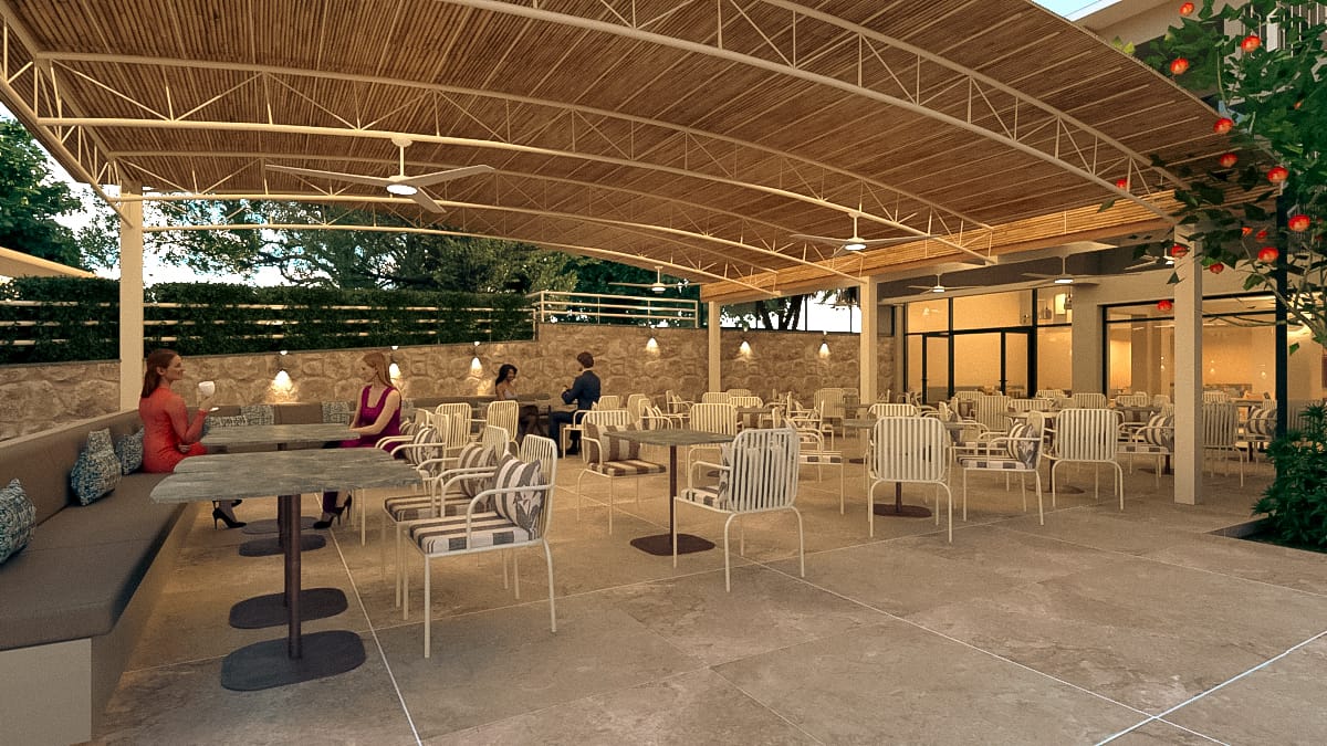 a group of people sitting at a table in a large room