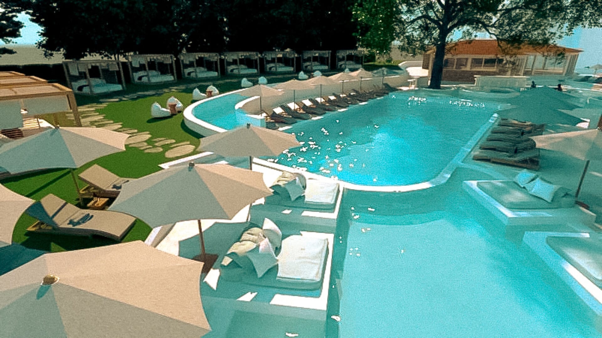 a pool with lounge chairs around it