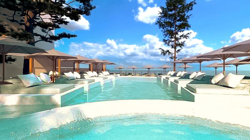 a pool with lounge chairs and umbrellas next to it