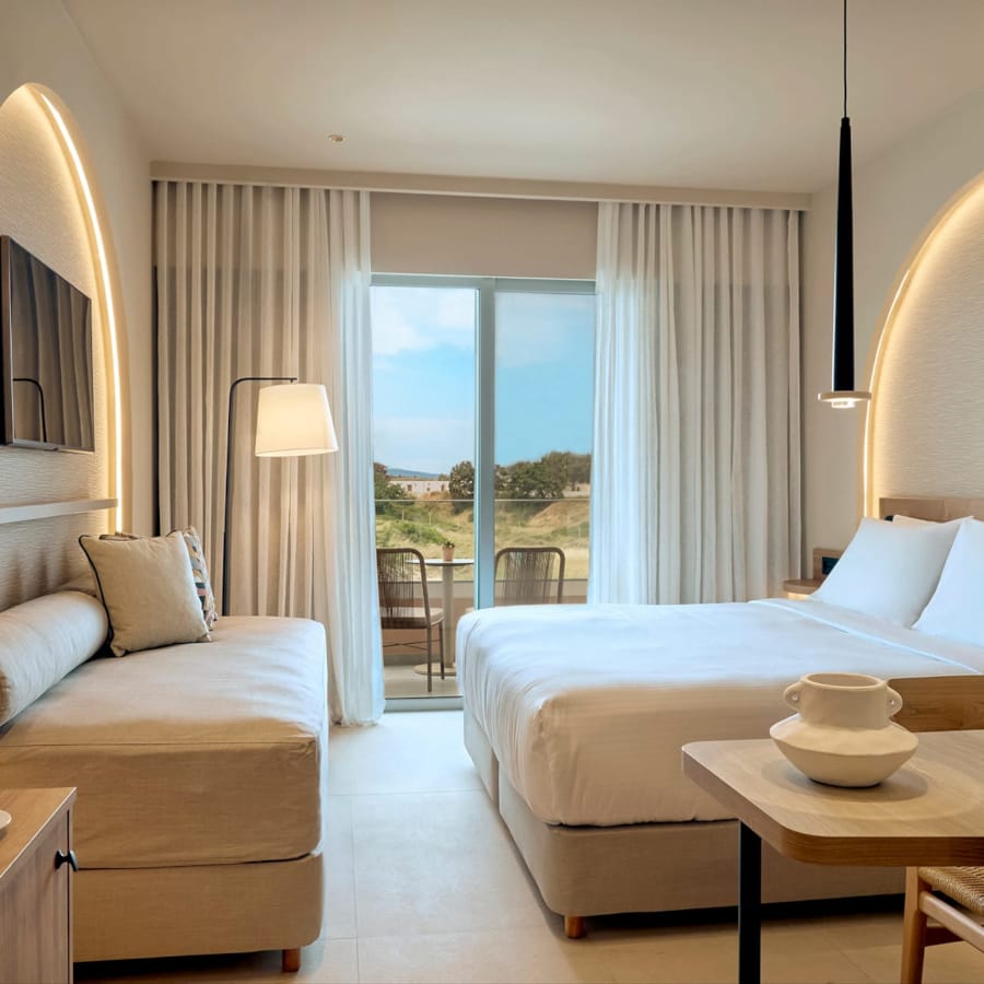 a bedroom with a large window