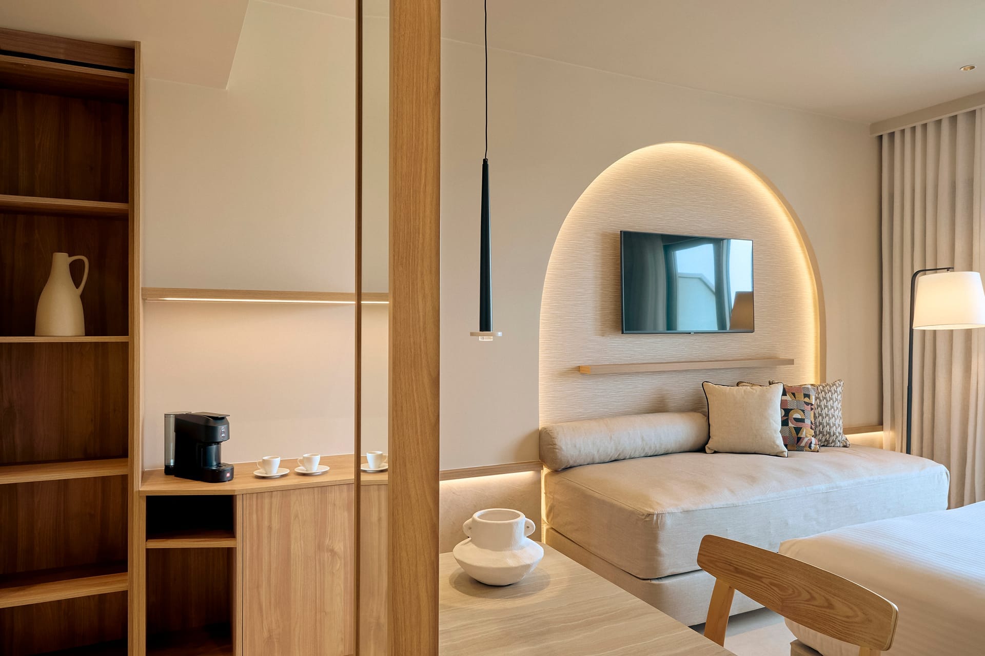 a room with a bed and a mirror