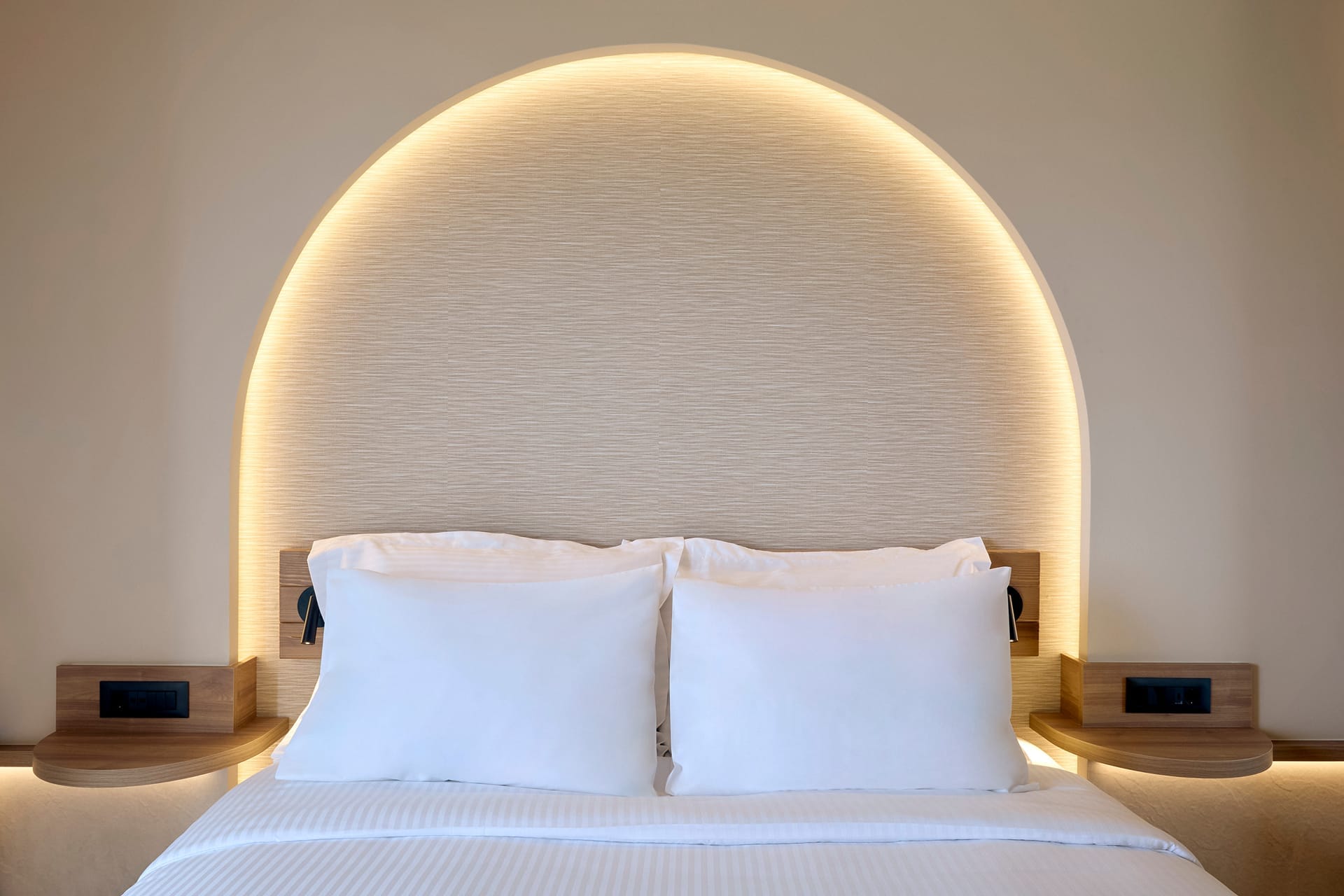 a bed with white pillows