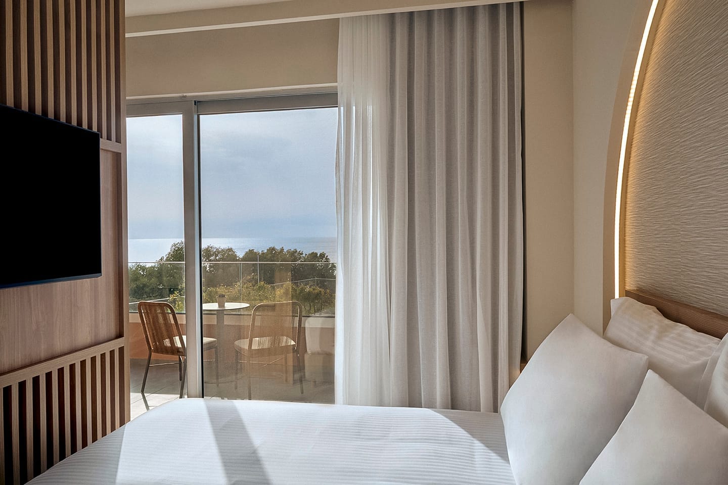 a room with a bed and a tv