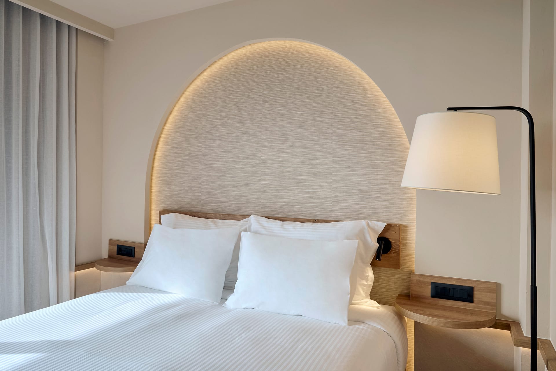 a bed with a lamp on it