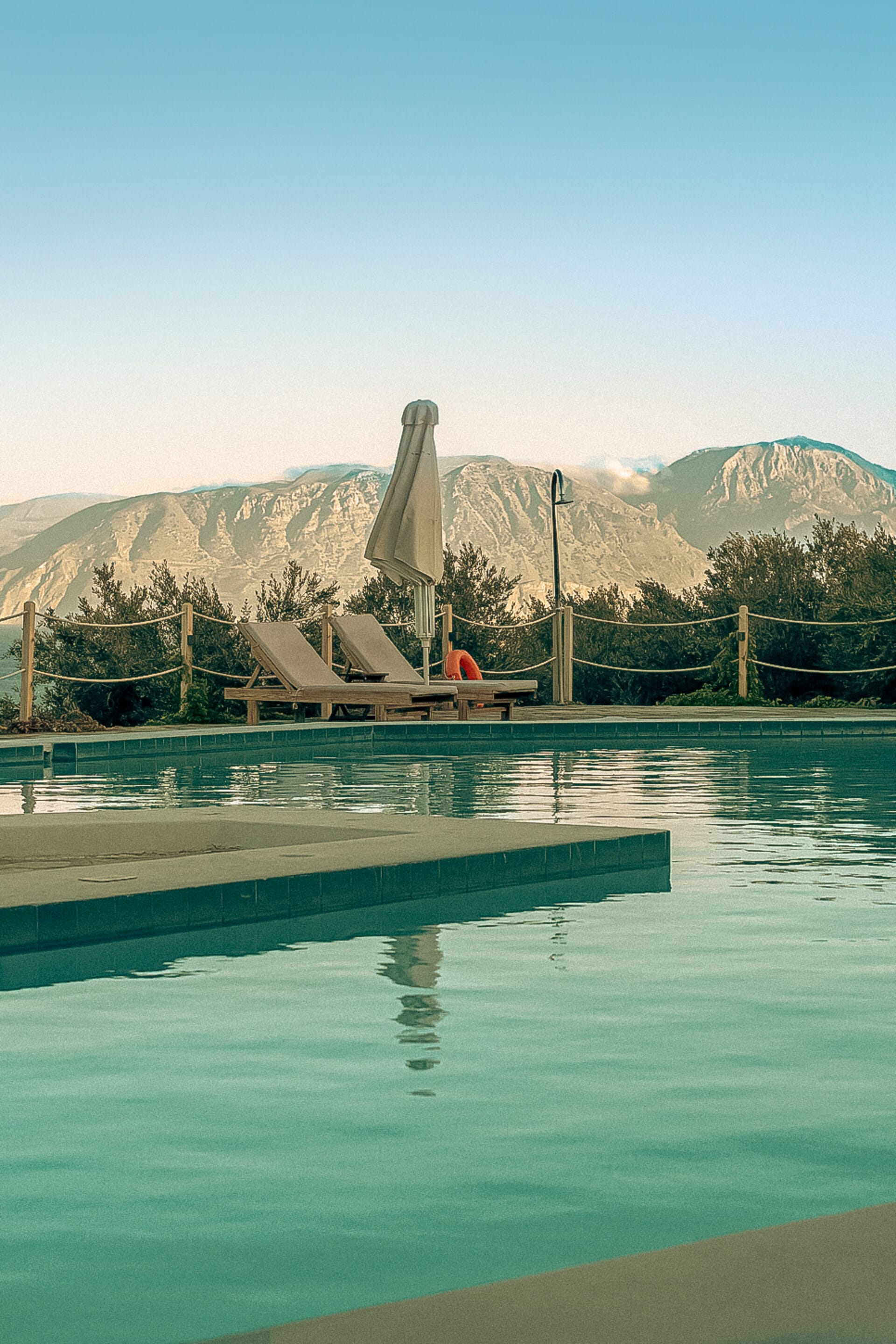 a pool with a slide and a slide in it