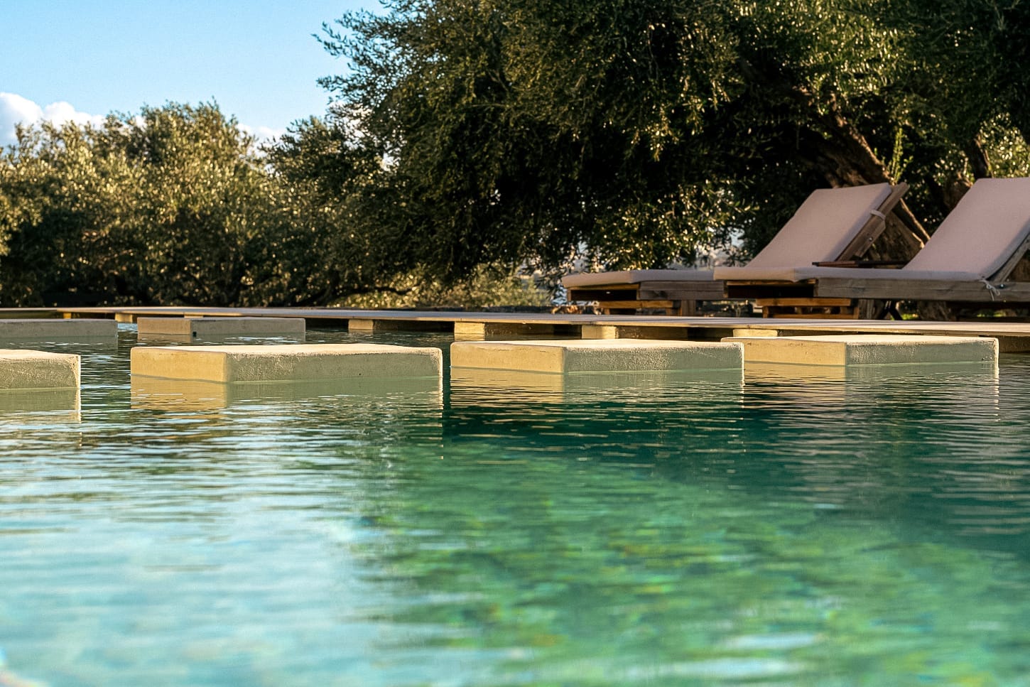 a pool with a building in the background