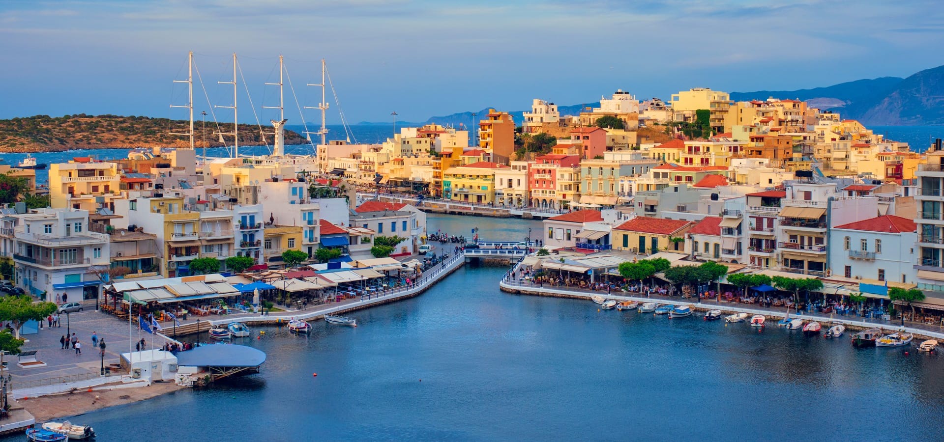 a city with many buildings and boats