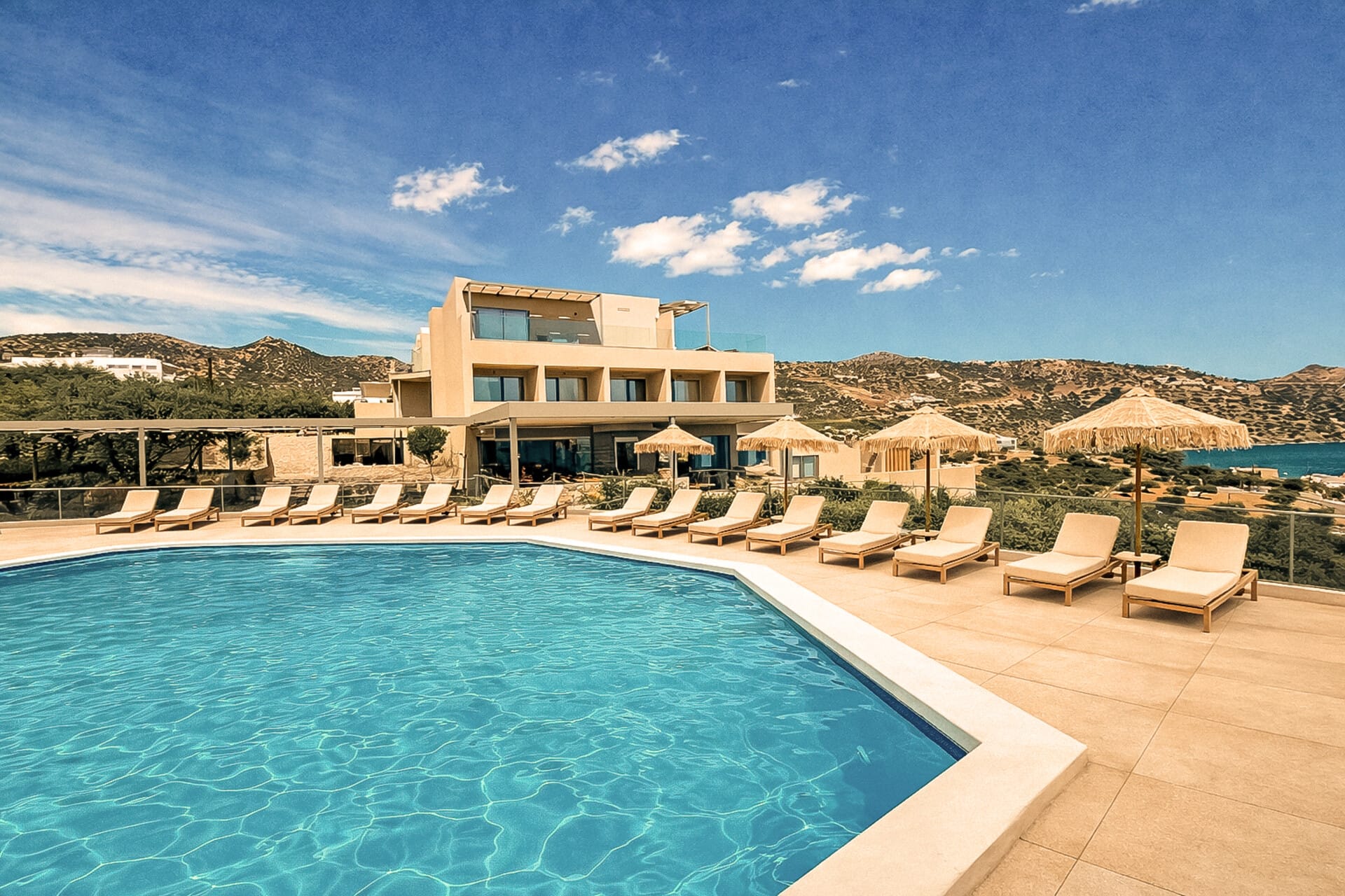 a pool with chairs around it