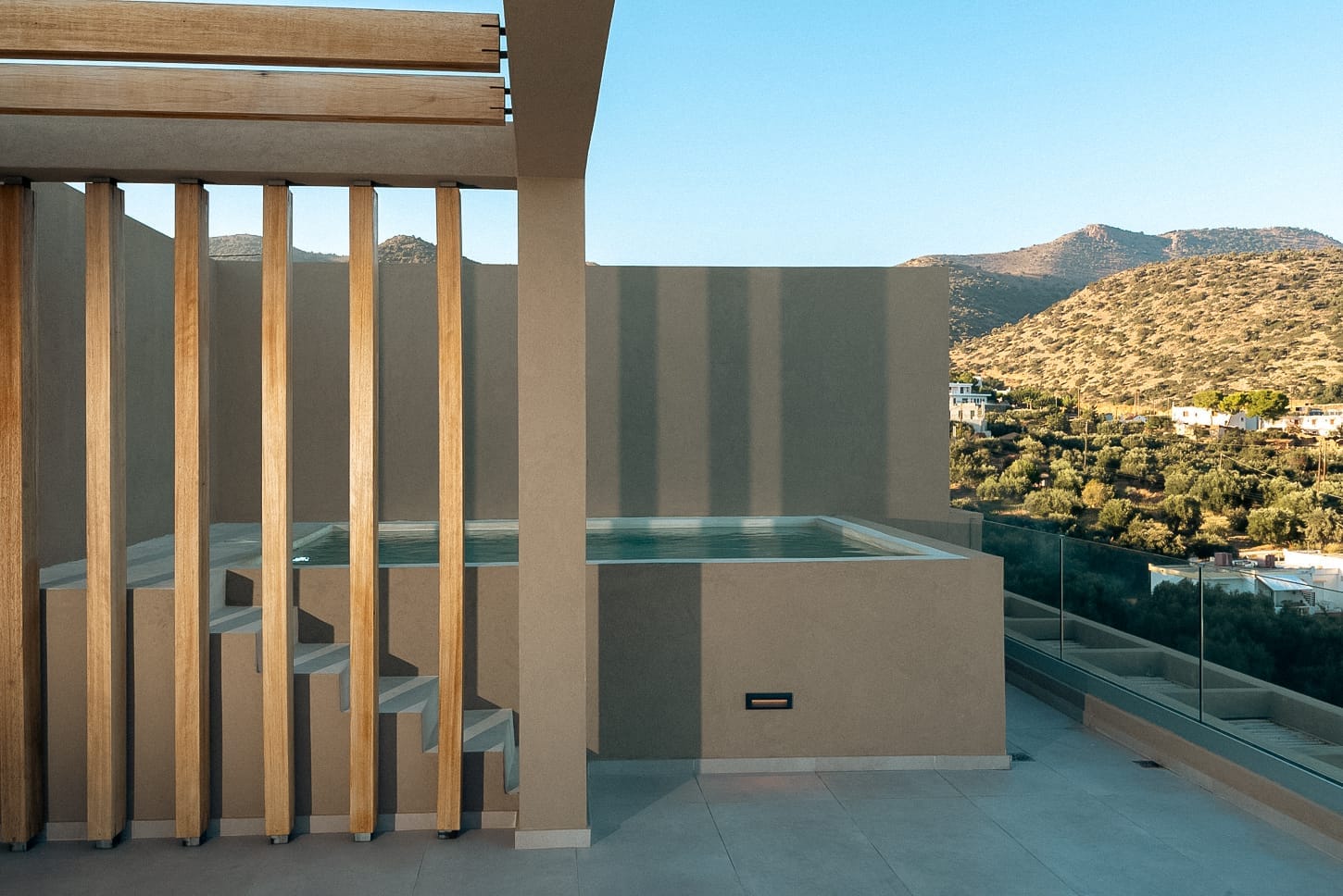 a deck with a view of a mountain and trees