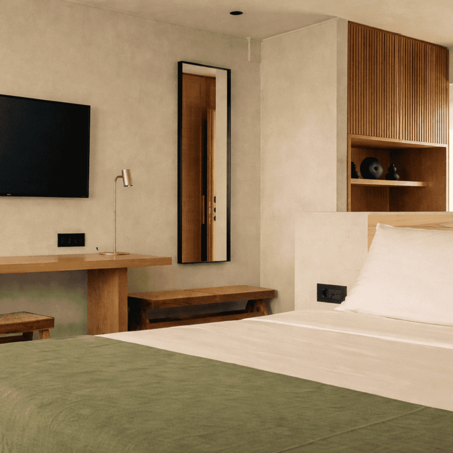 a room with a bed and a tv