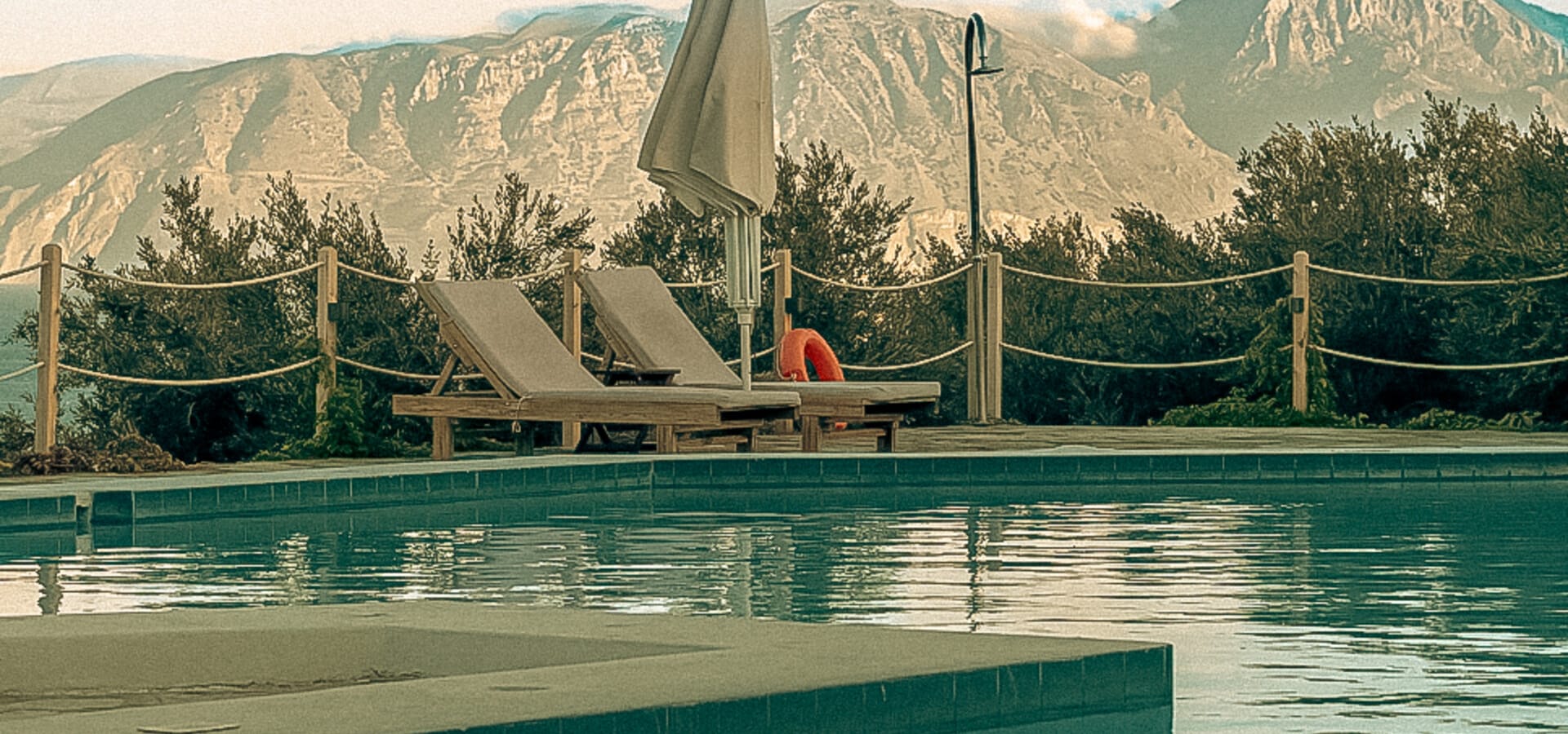 a pool with a slide and a slide in it