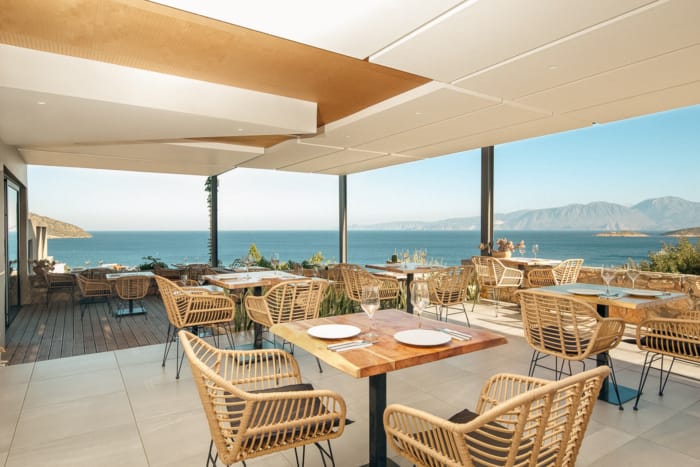 a patio with tables and chairs