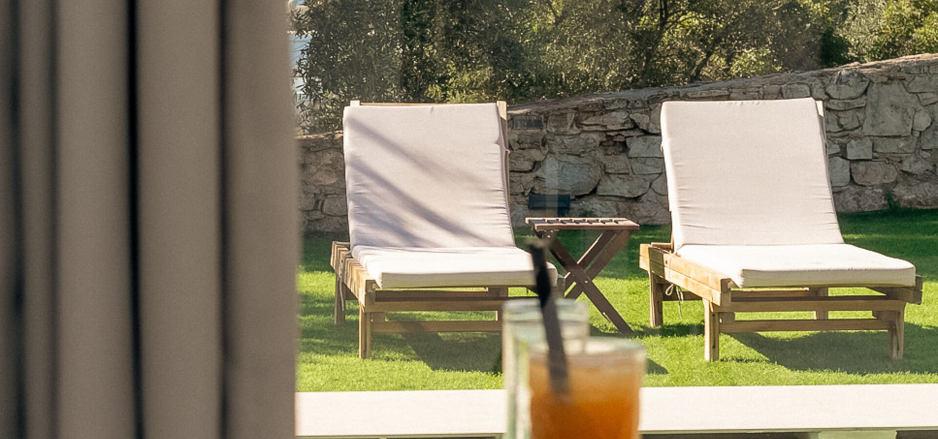 a glass of orange juice on a table with a glass of orange juice