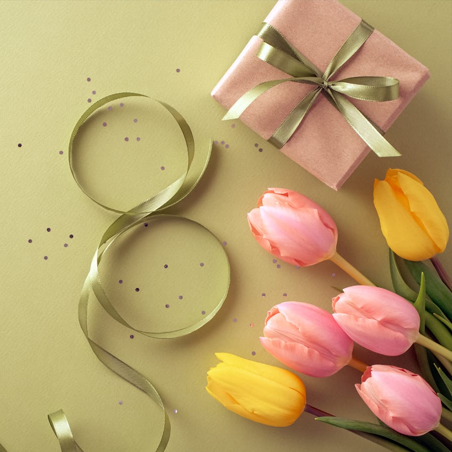 a couple of glasses with flowers in them