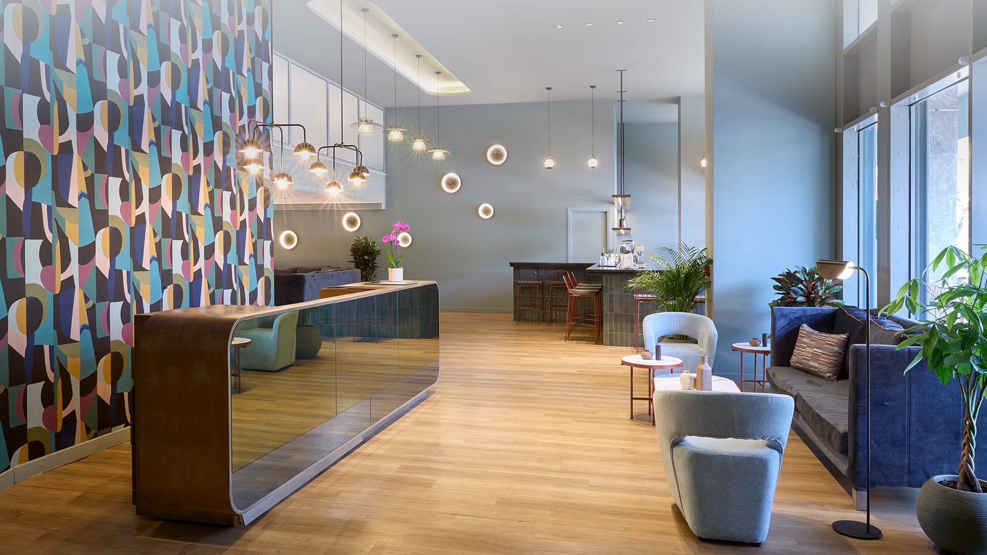 a room with a couch and chairs