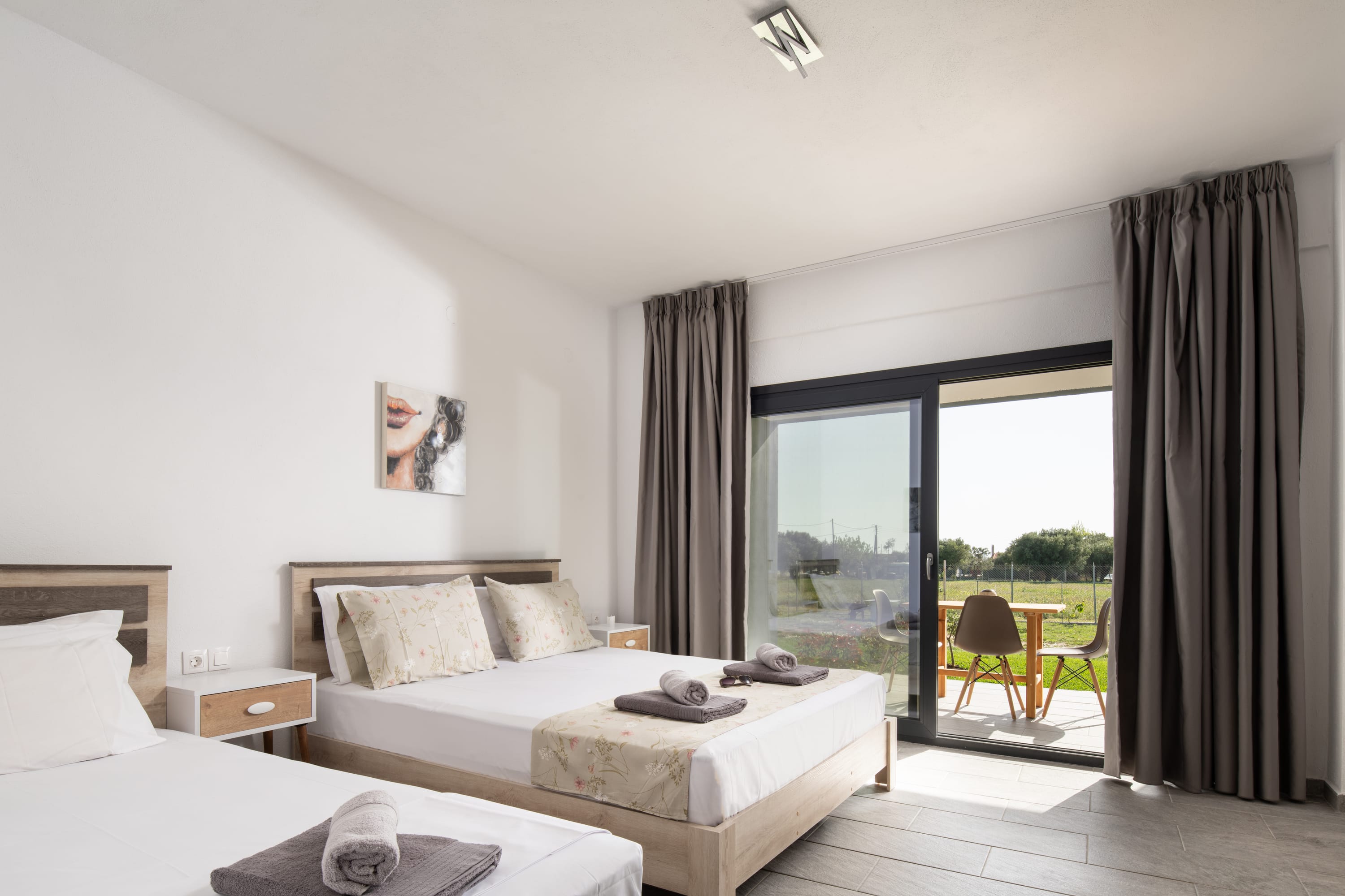 a bedroom with a large window