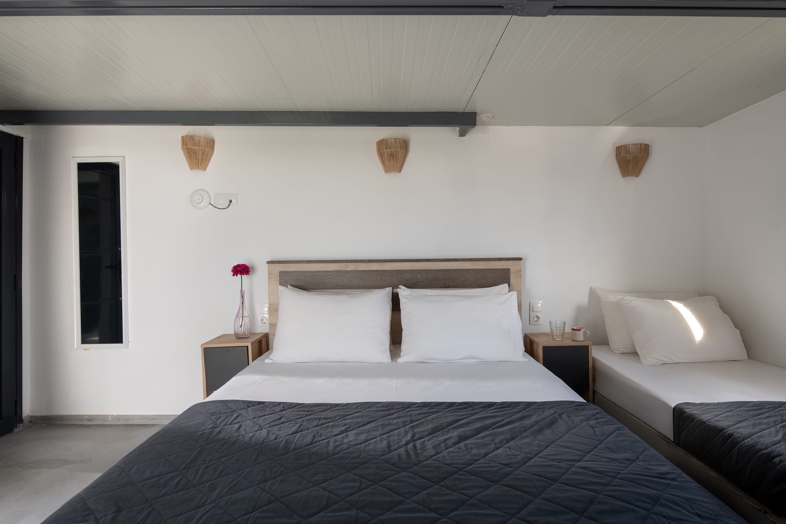 a bed with a white bed spread