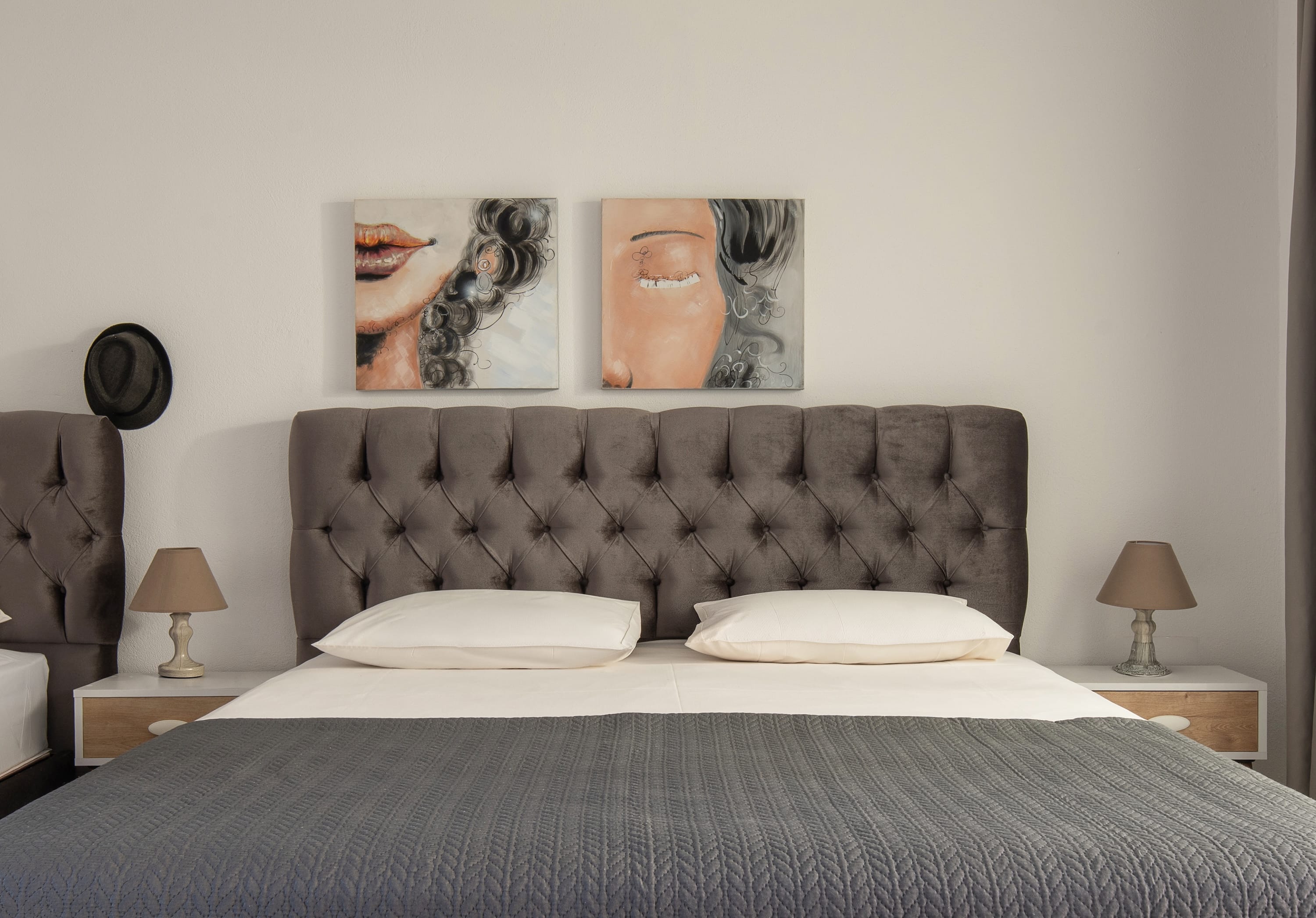 a bed with a large headboard