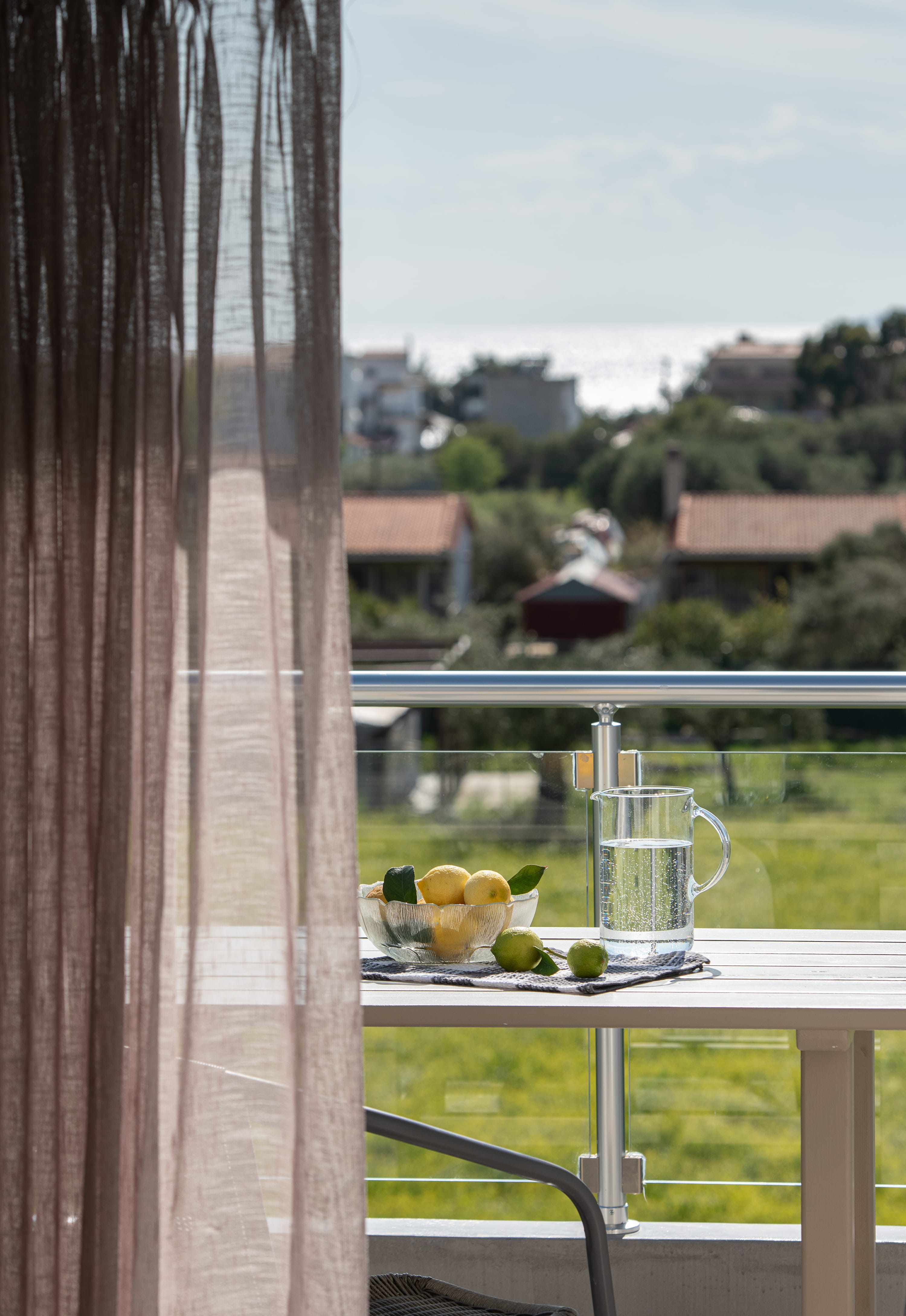 a table with a glass and fruit on it