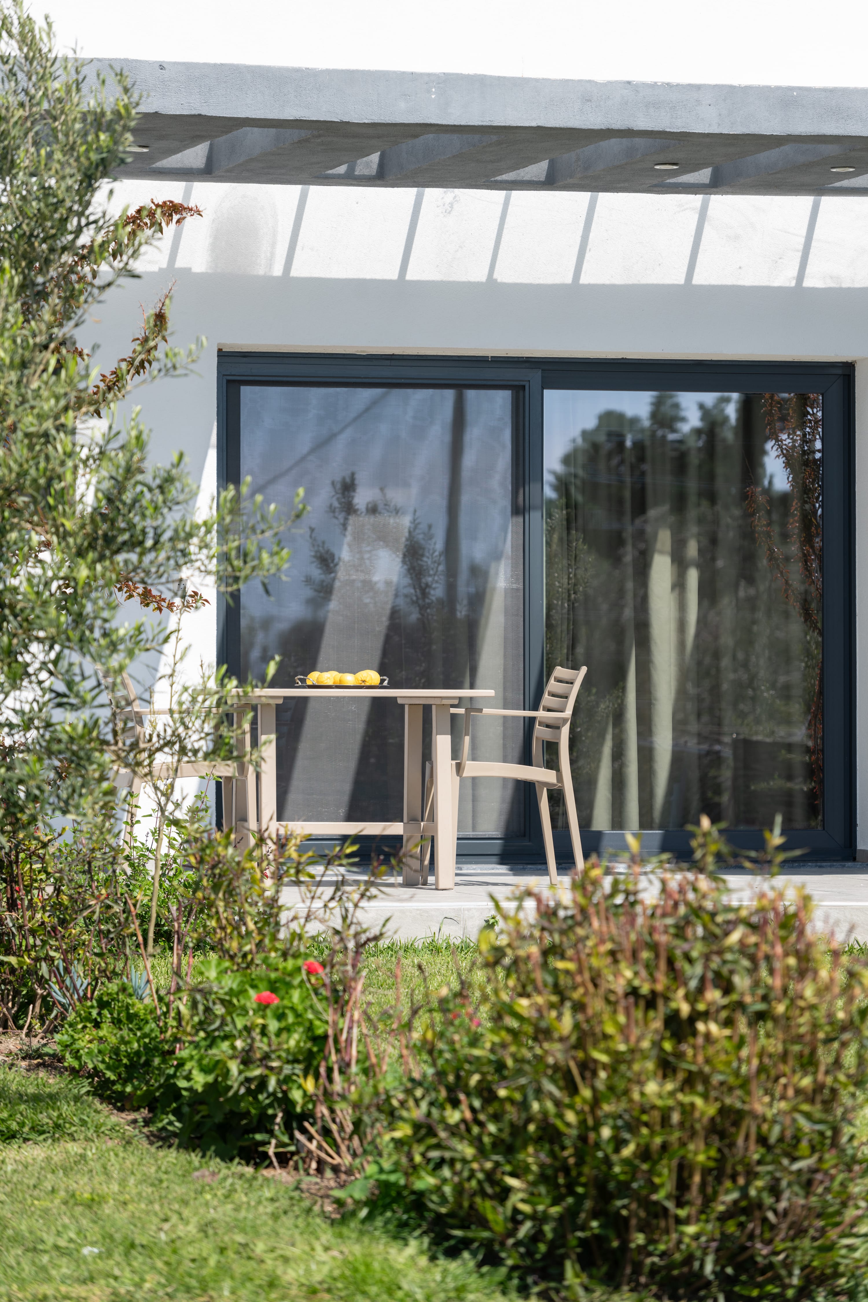 a chair and a table outside a house
