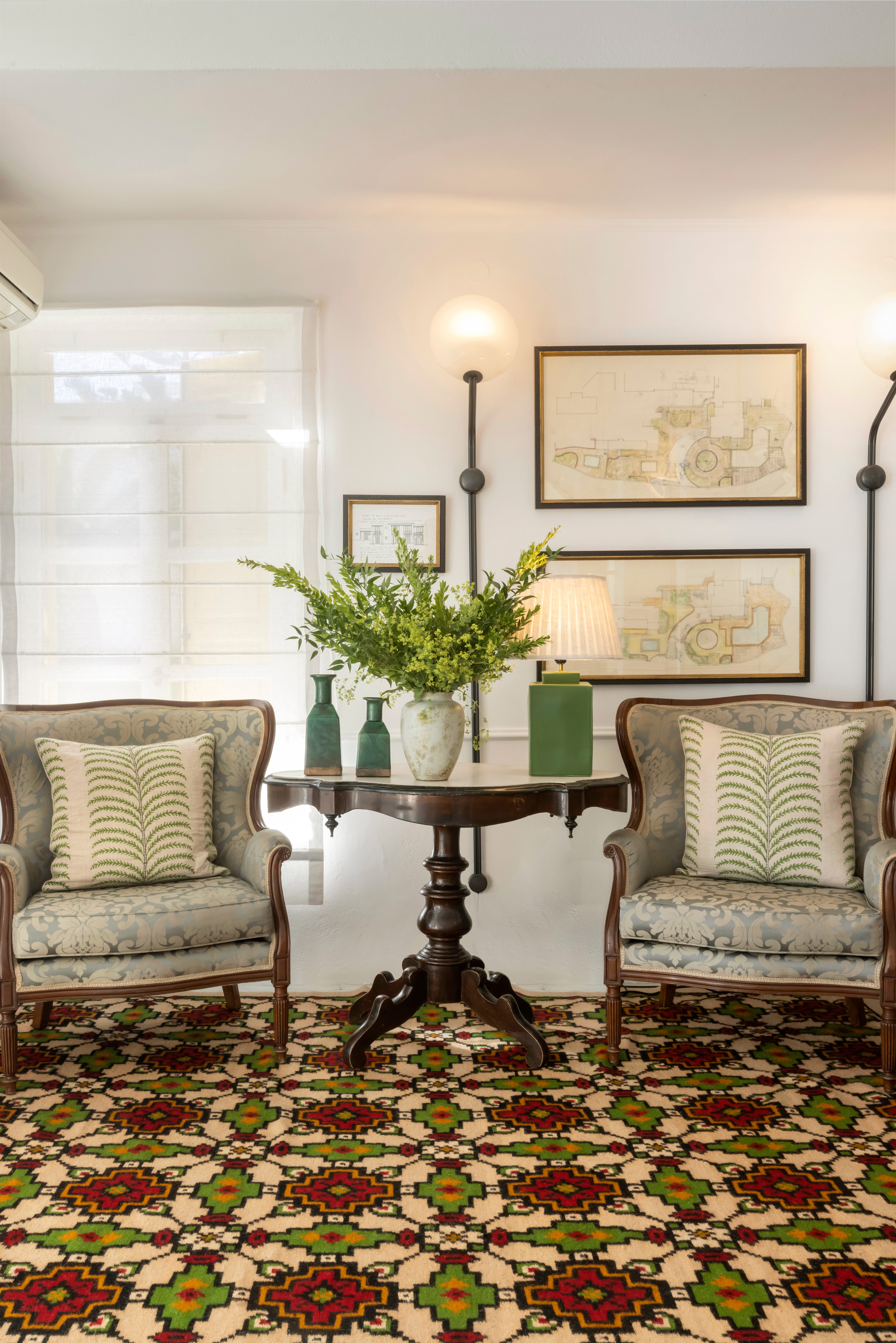 a living room with a table and chairs