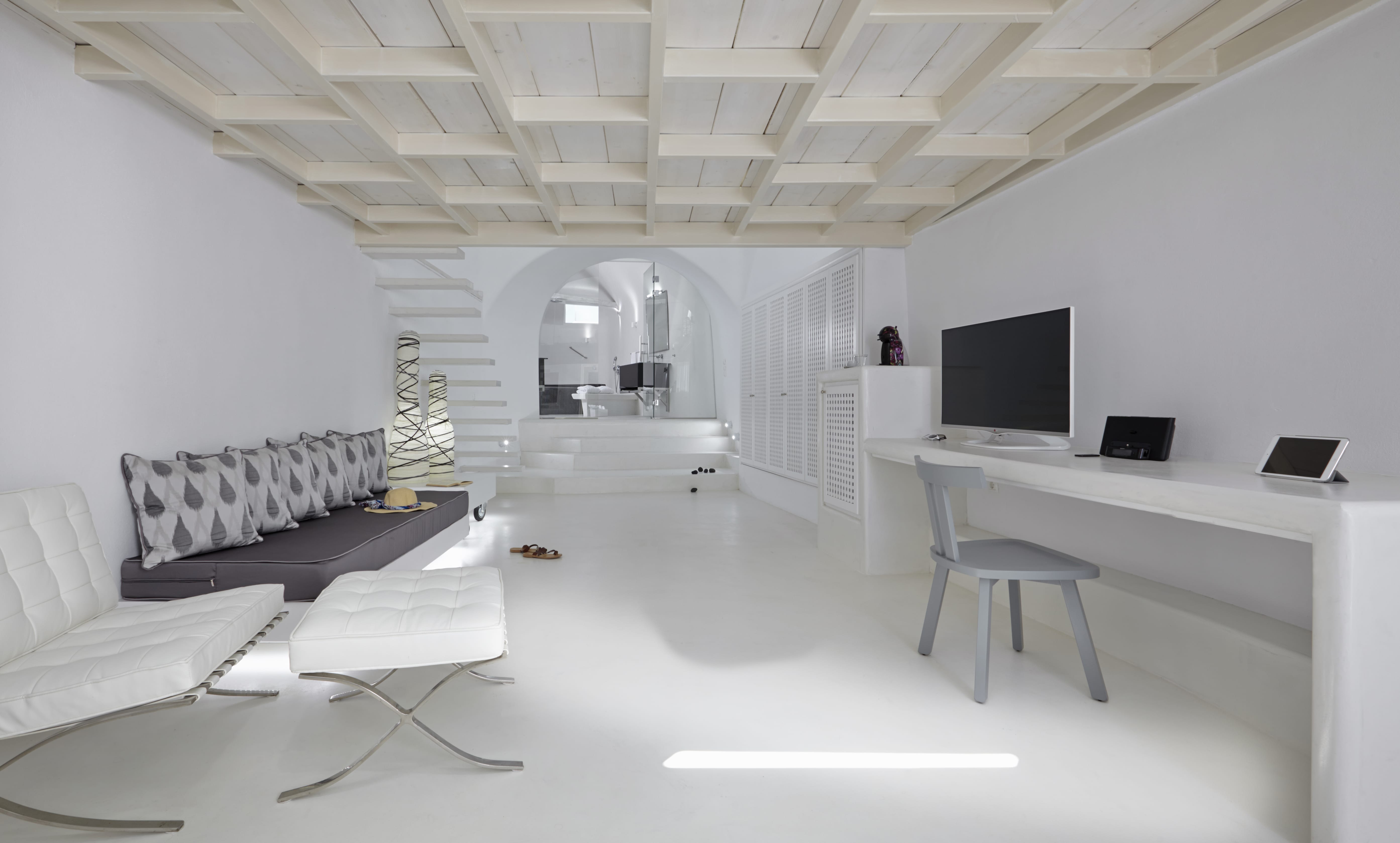 a room with a desk and a couch