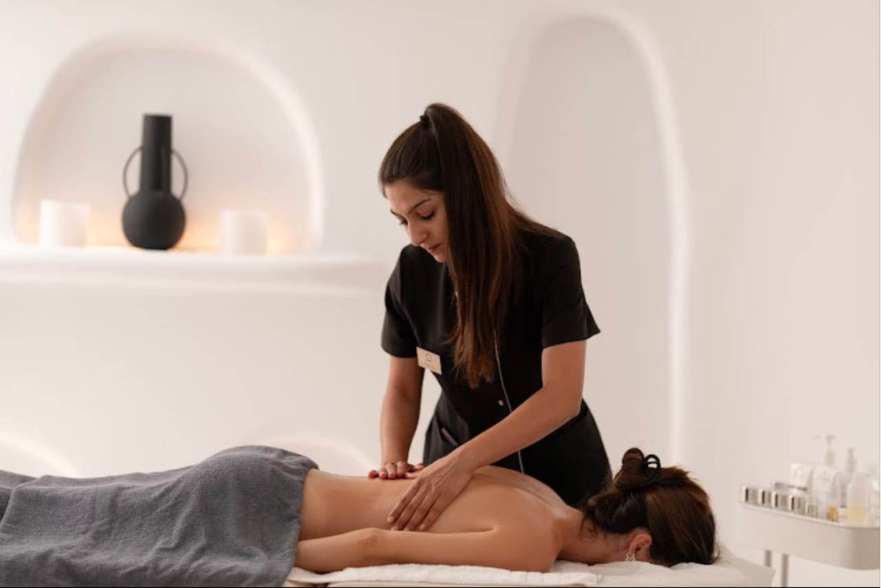 a woman sitting on a bed