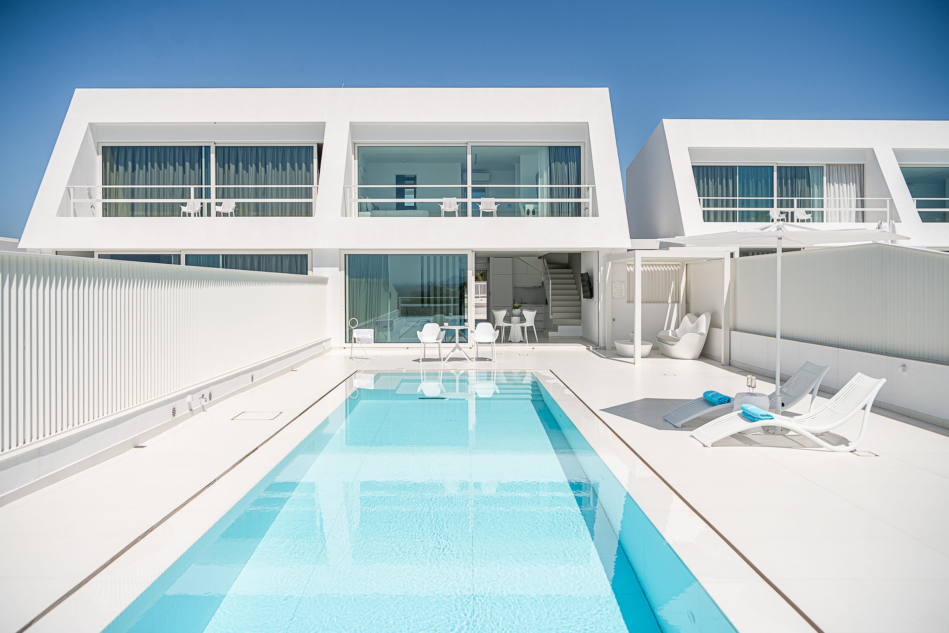 a swimming pool in a white house